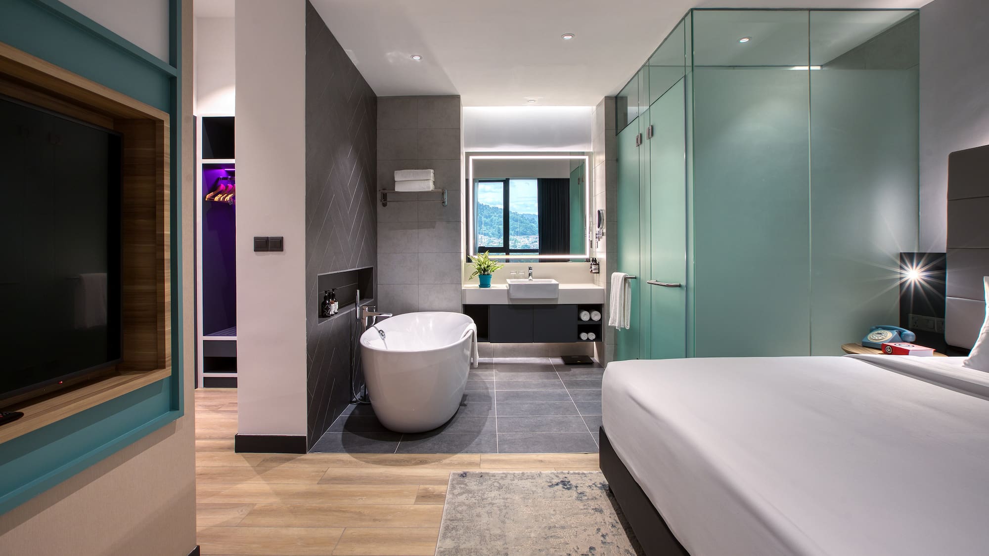 a room with a bed and bathtub