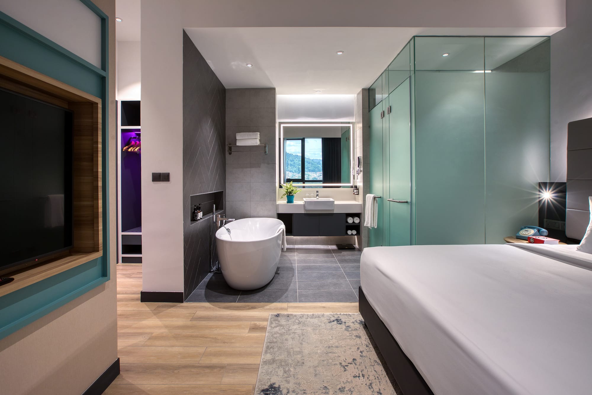 a room with a bed and bathtub