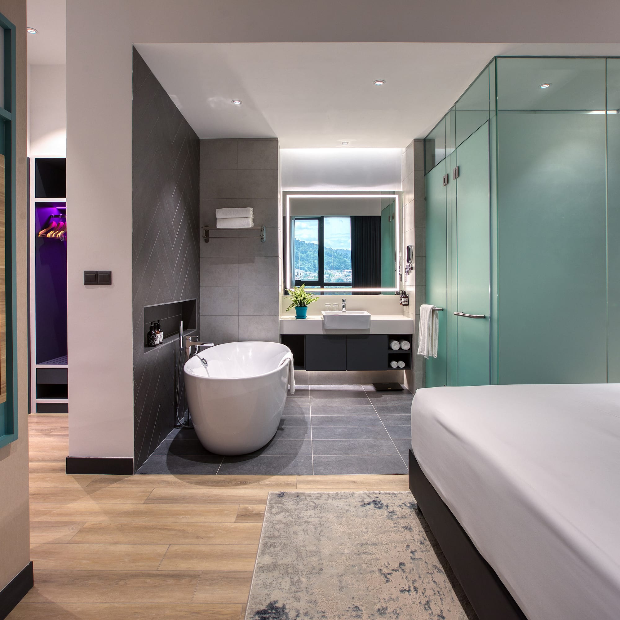 a room with a bed and bathtub