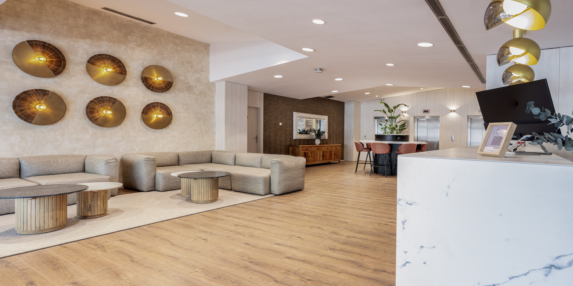 a lobby with a reception desk and a couch