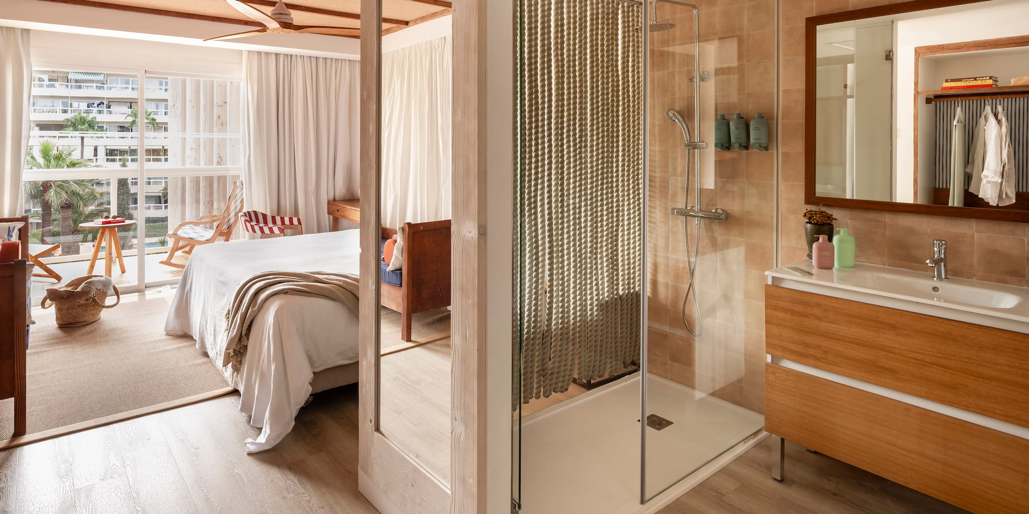 a bathroom with a bed and a shower