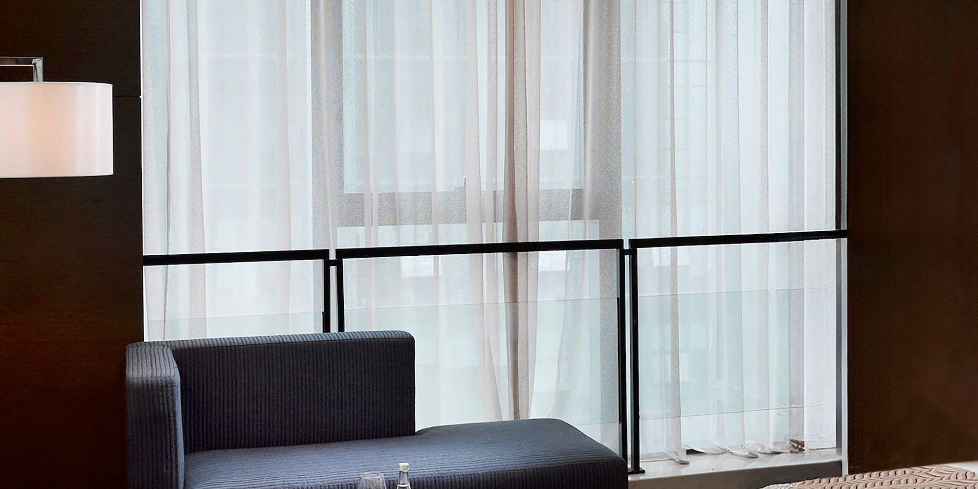 a room with a bed and a chair