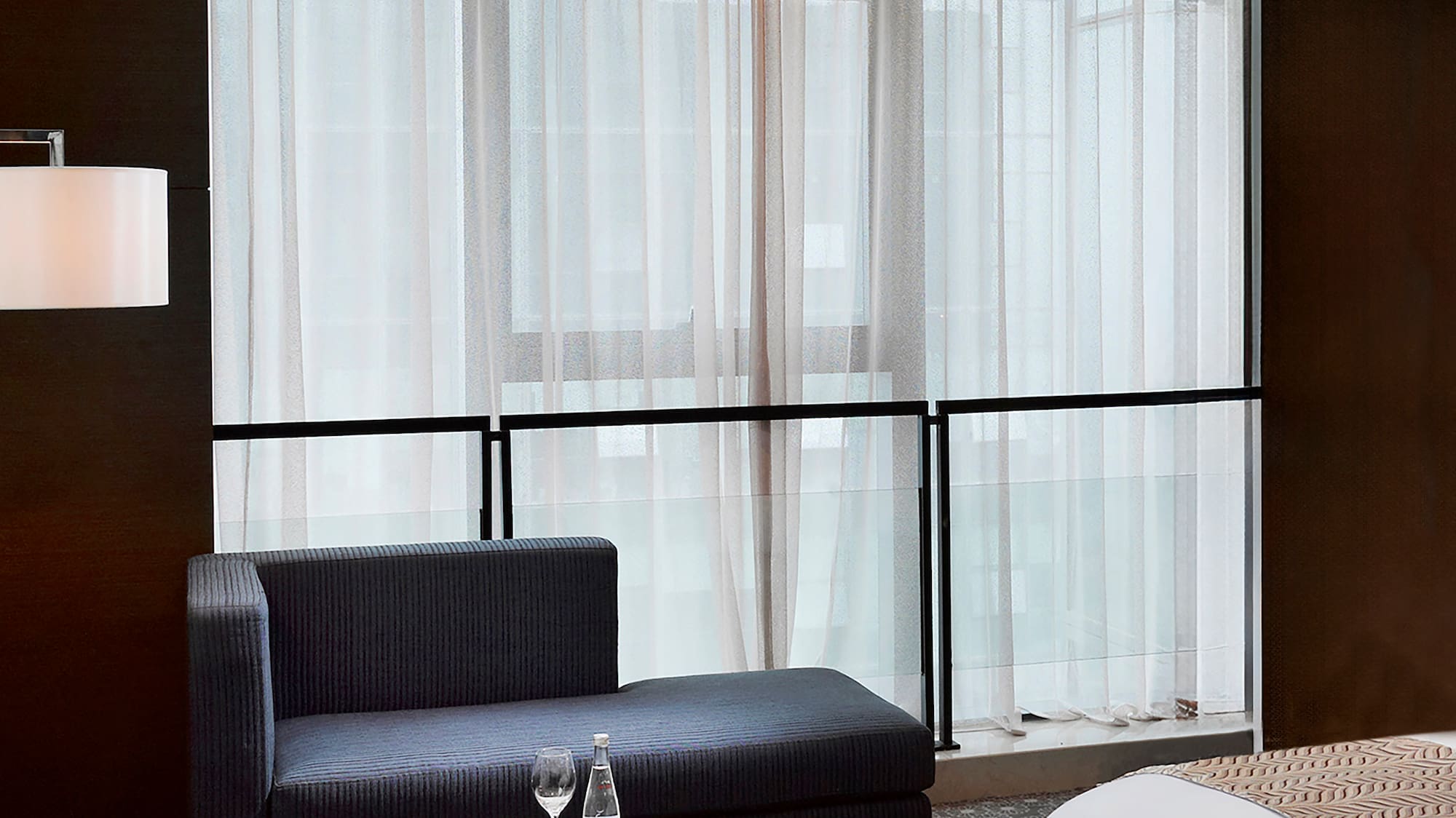 a room with a bed and a chair