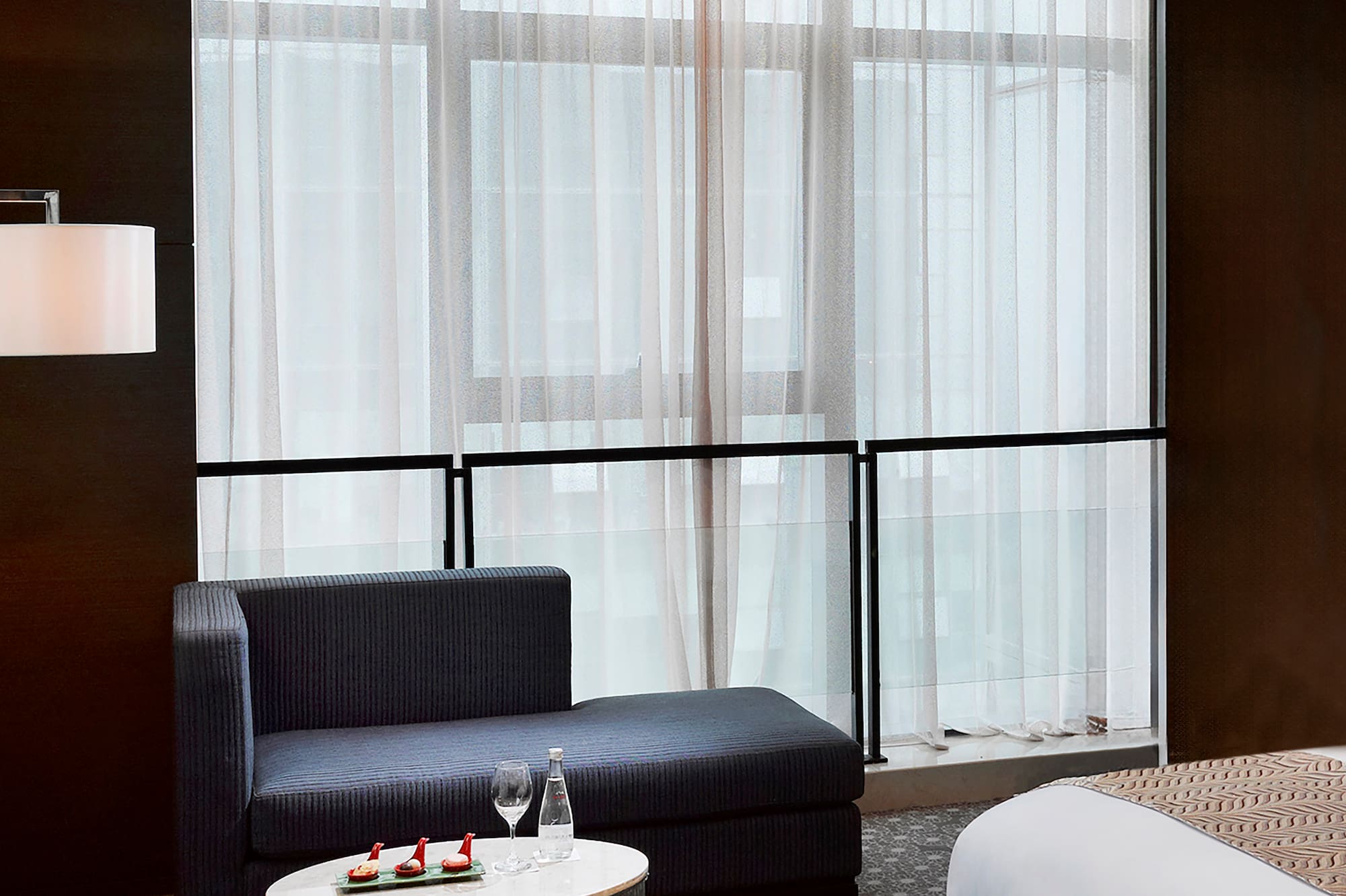 a room with a bed and a chair