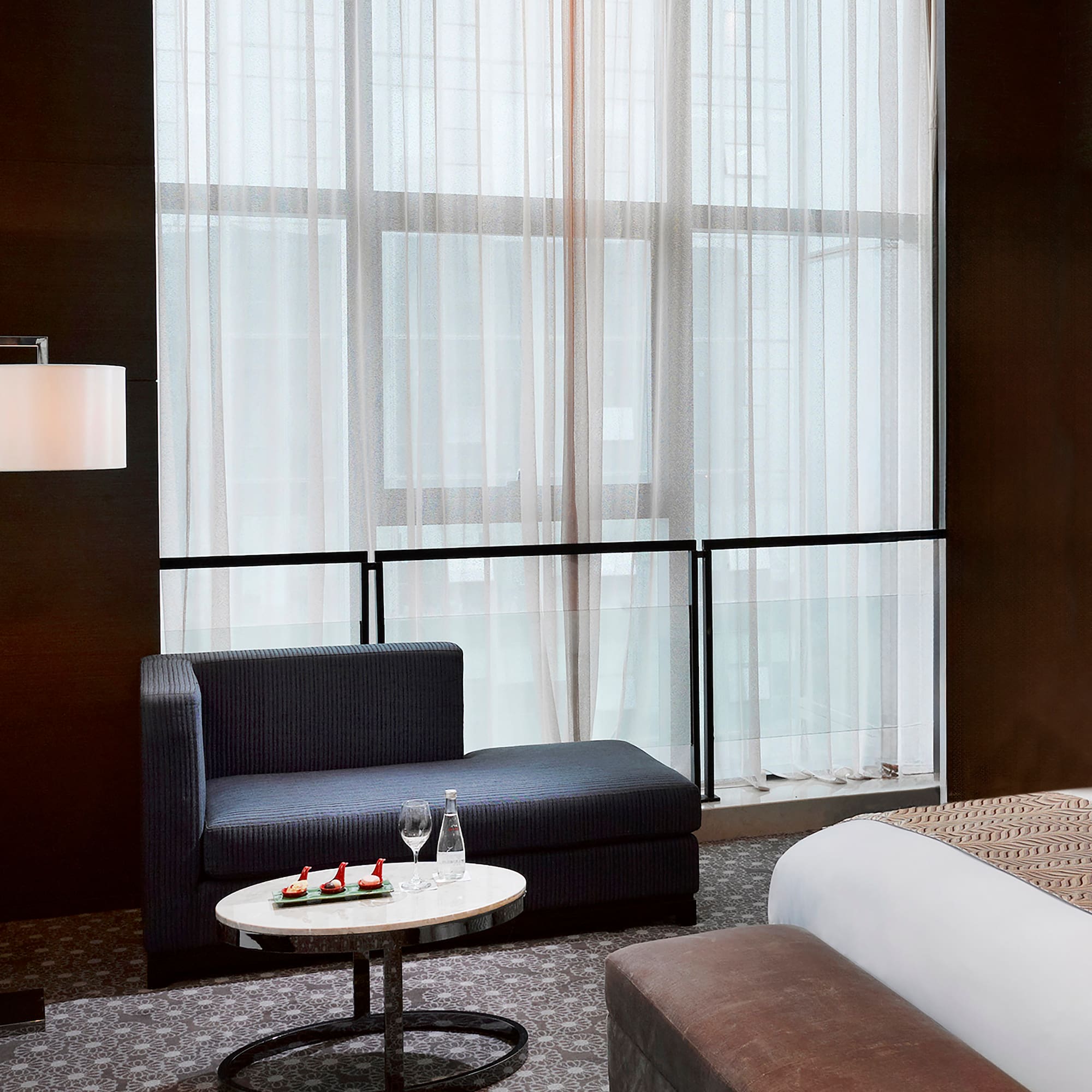 a room with a bed and a chair