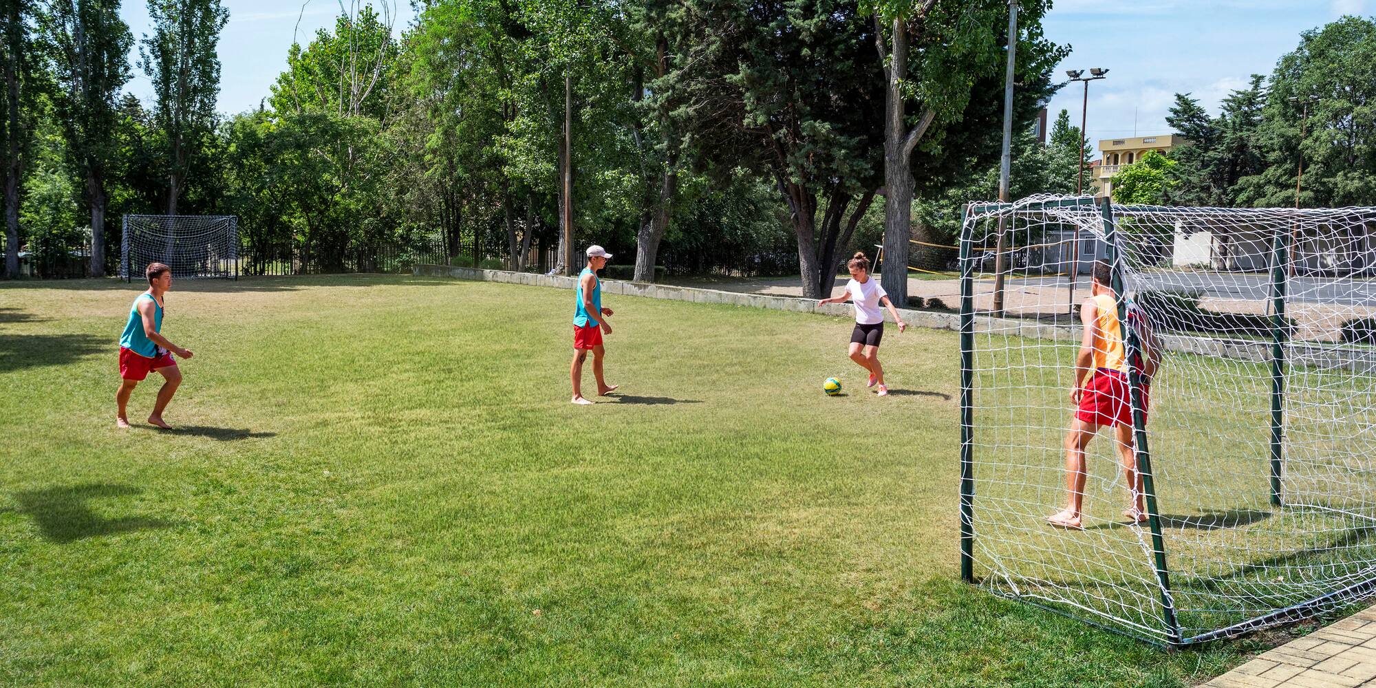 a group of kids playing football