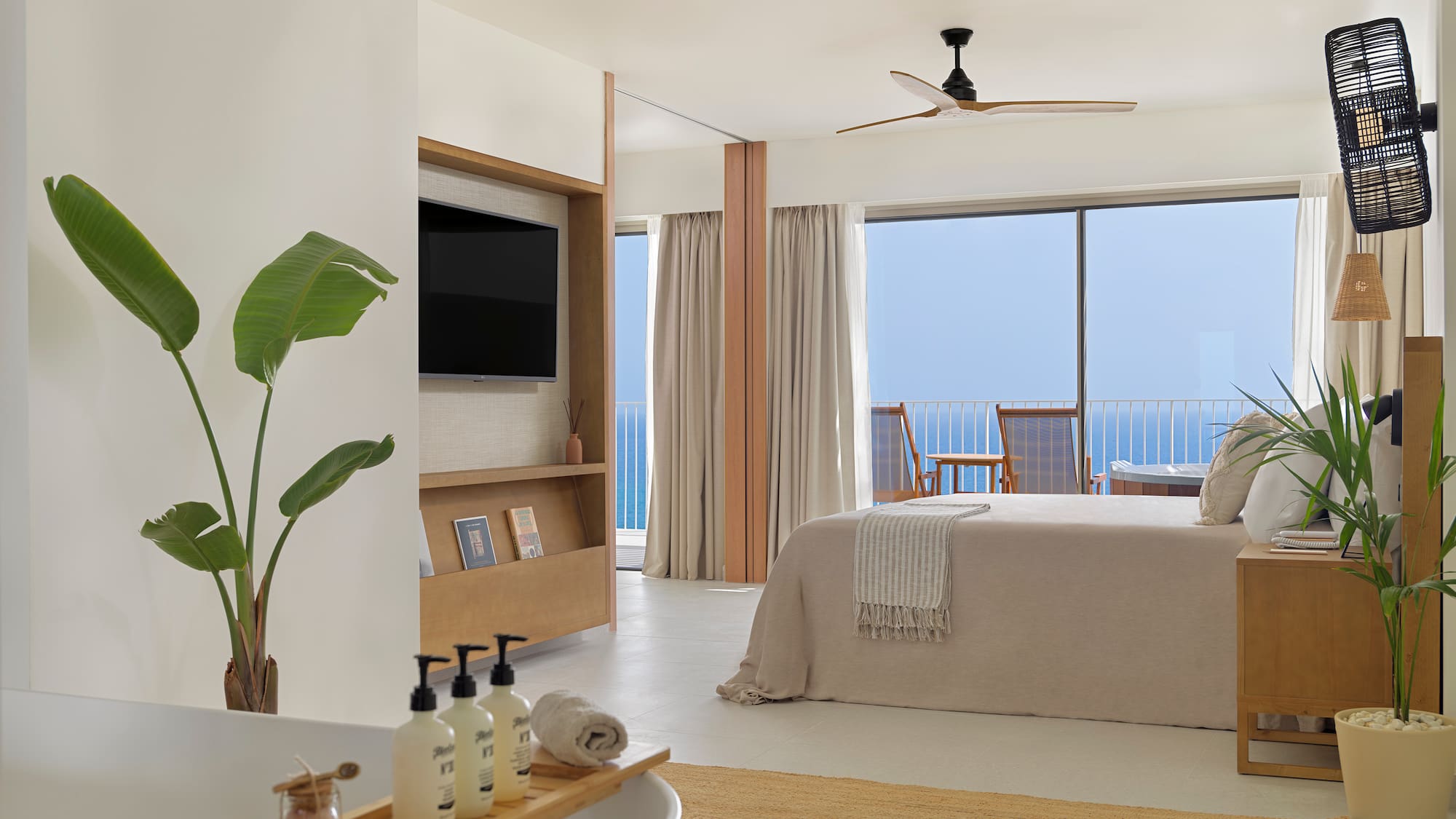 a bedroom with a television and a bed