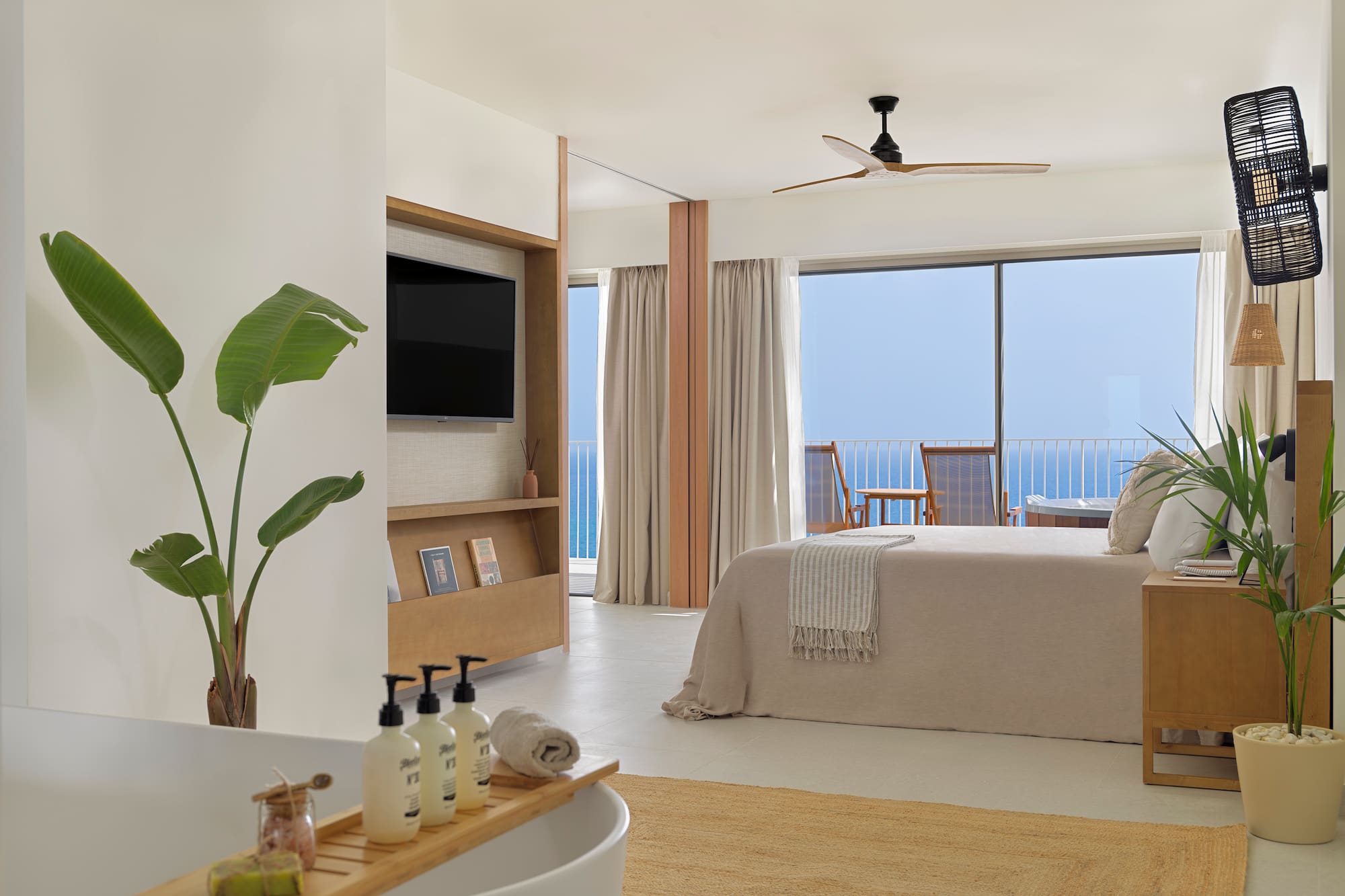 a bedroom with a television and a bed