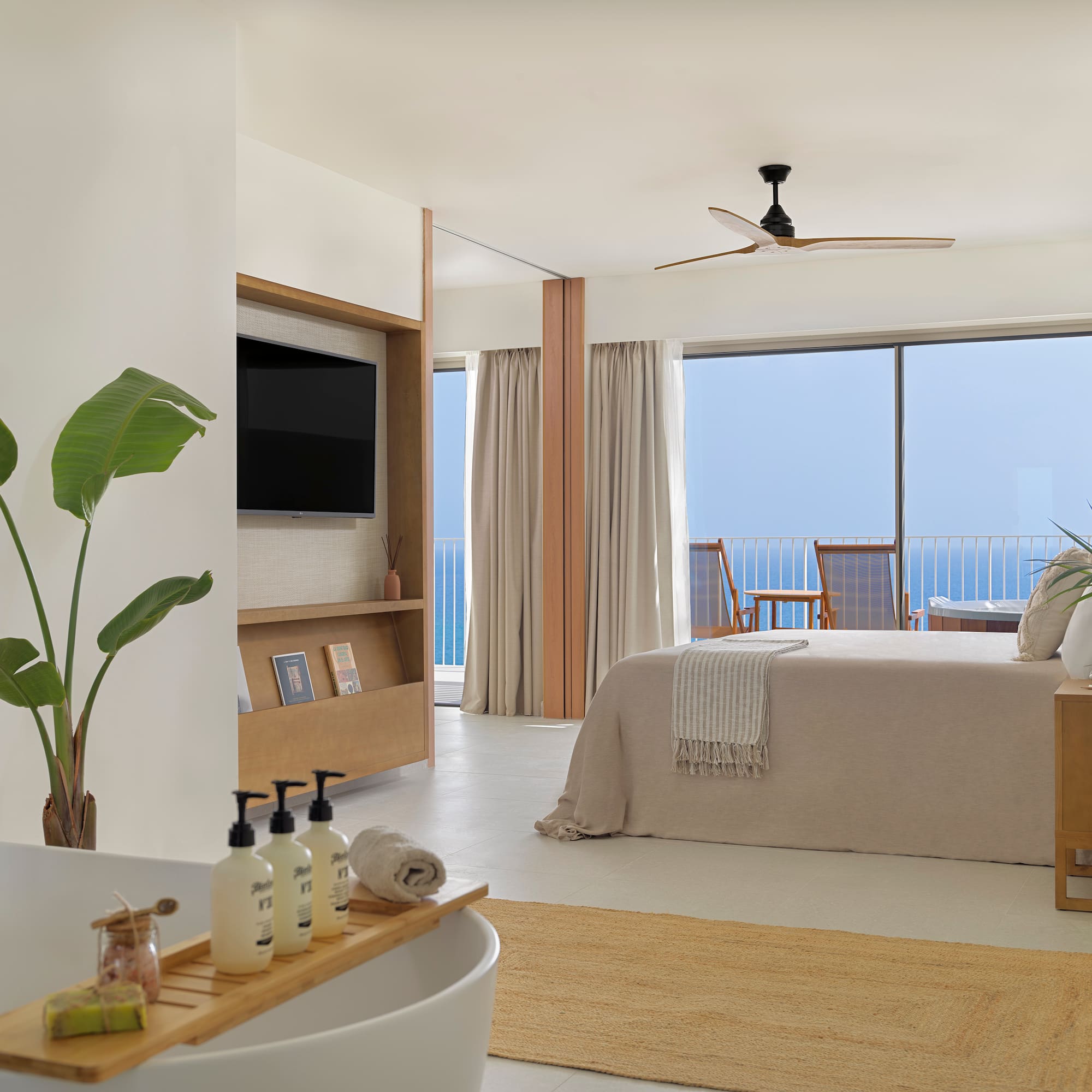 a bedroom with a television and a bed