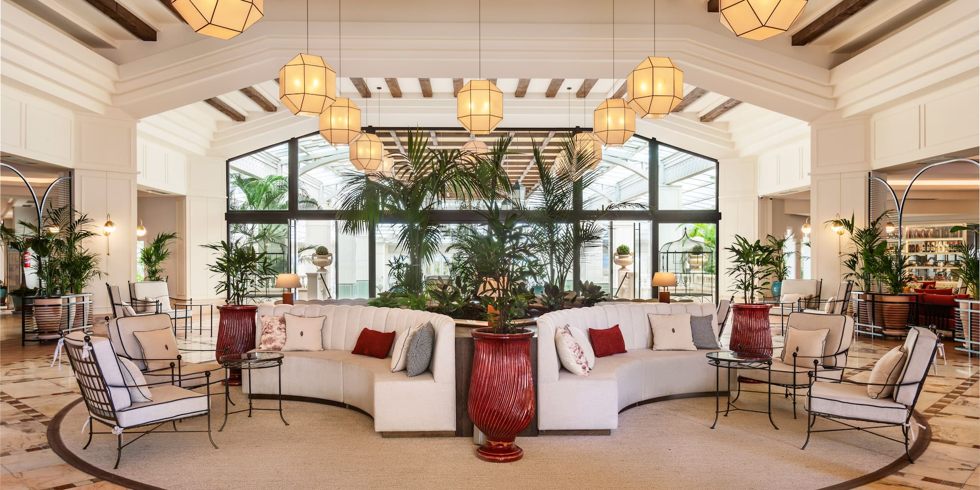 a room with a large round table and chairs