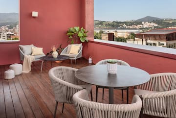 a patio with chairs and table
