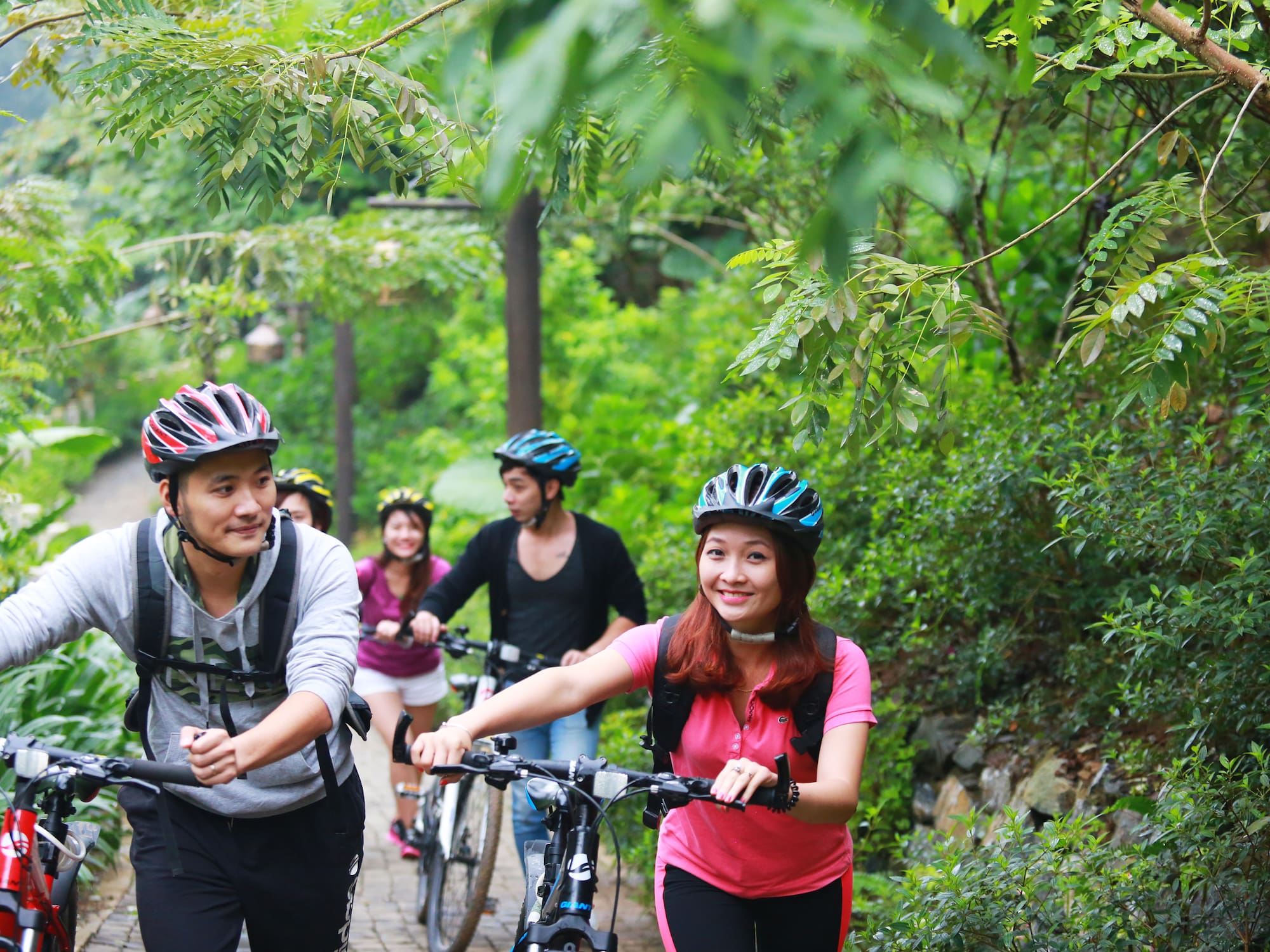 a group of people riding bikes