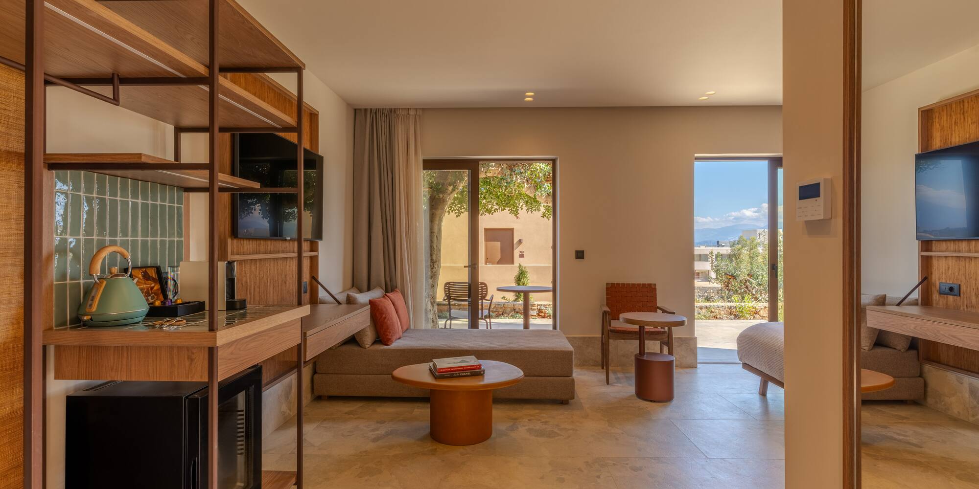 a room with a bed and a television