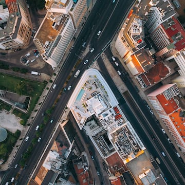 a bedroom with a bed and a round table
