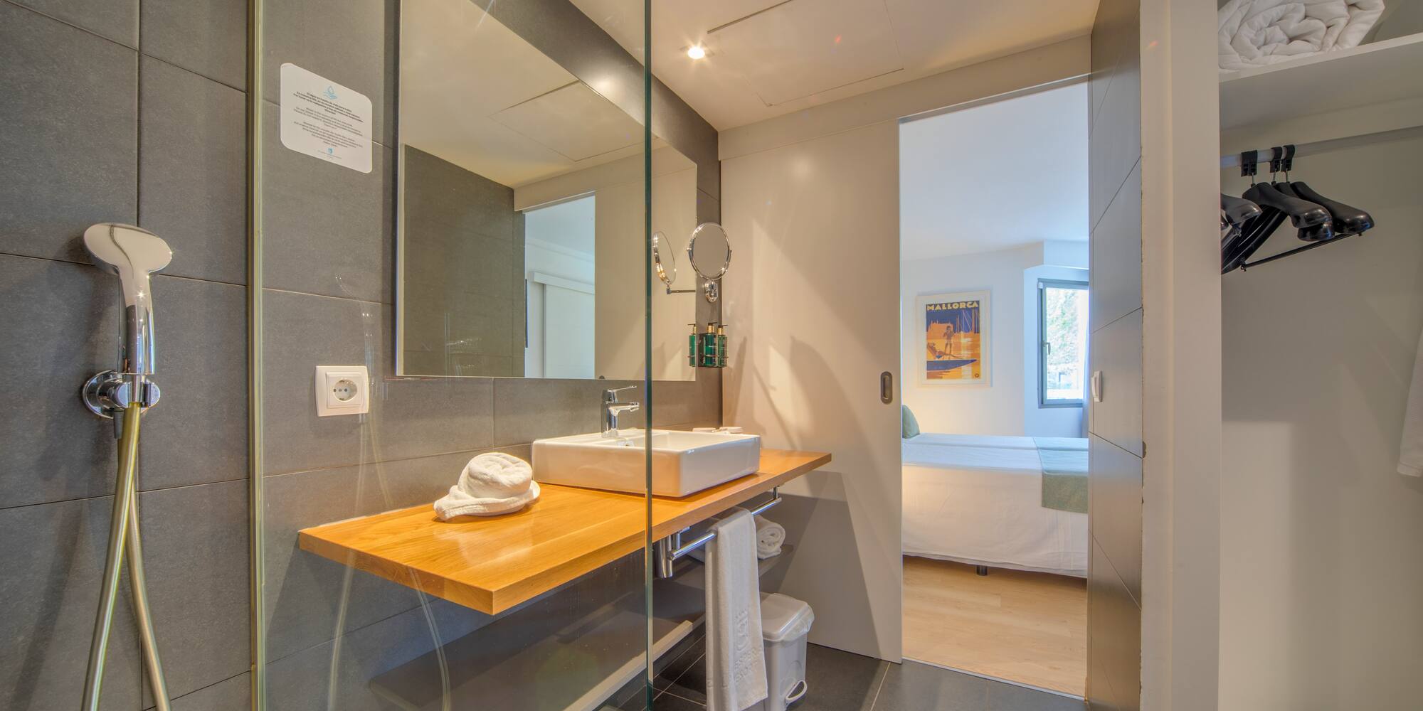 a bathroom with a glass shower door