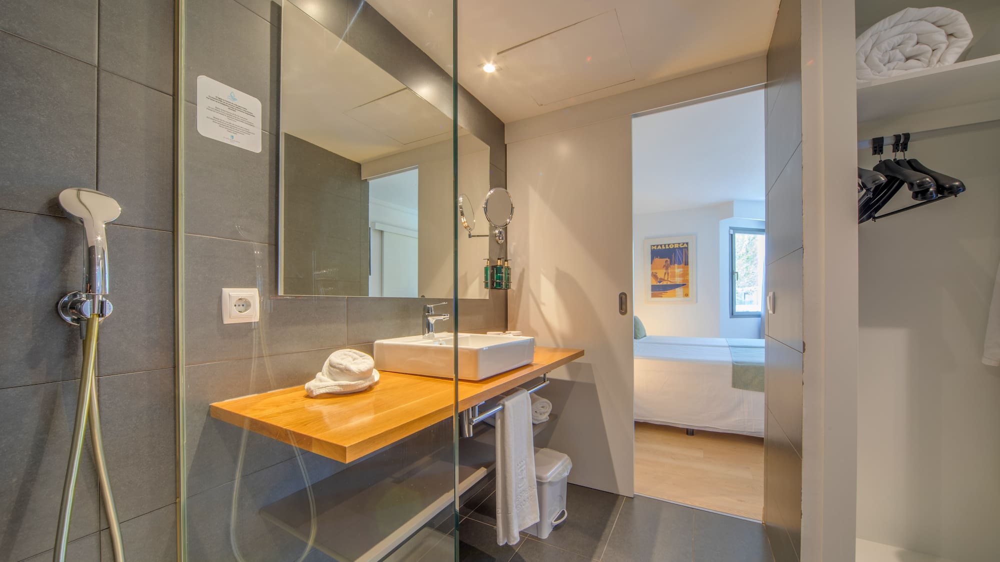 a bathroom with a glass shower door