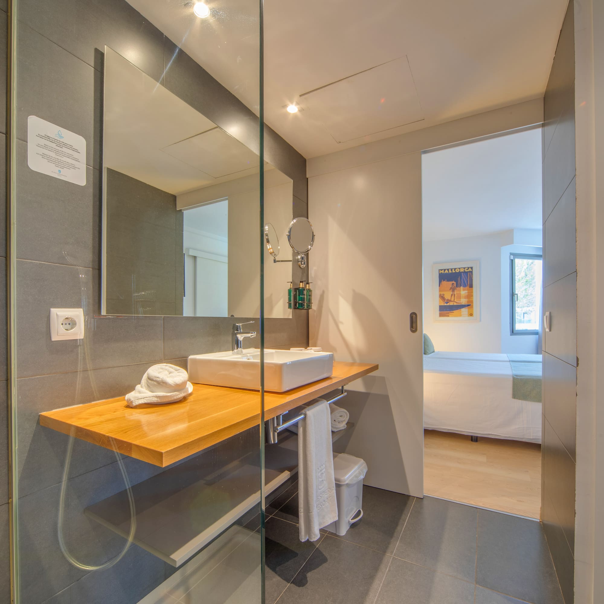 a bathroom with a glass shower door