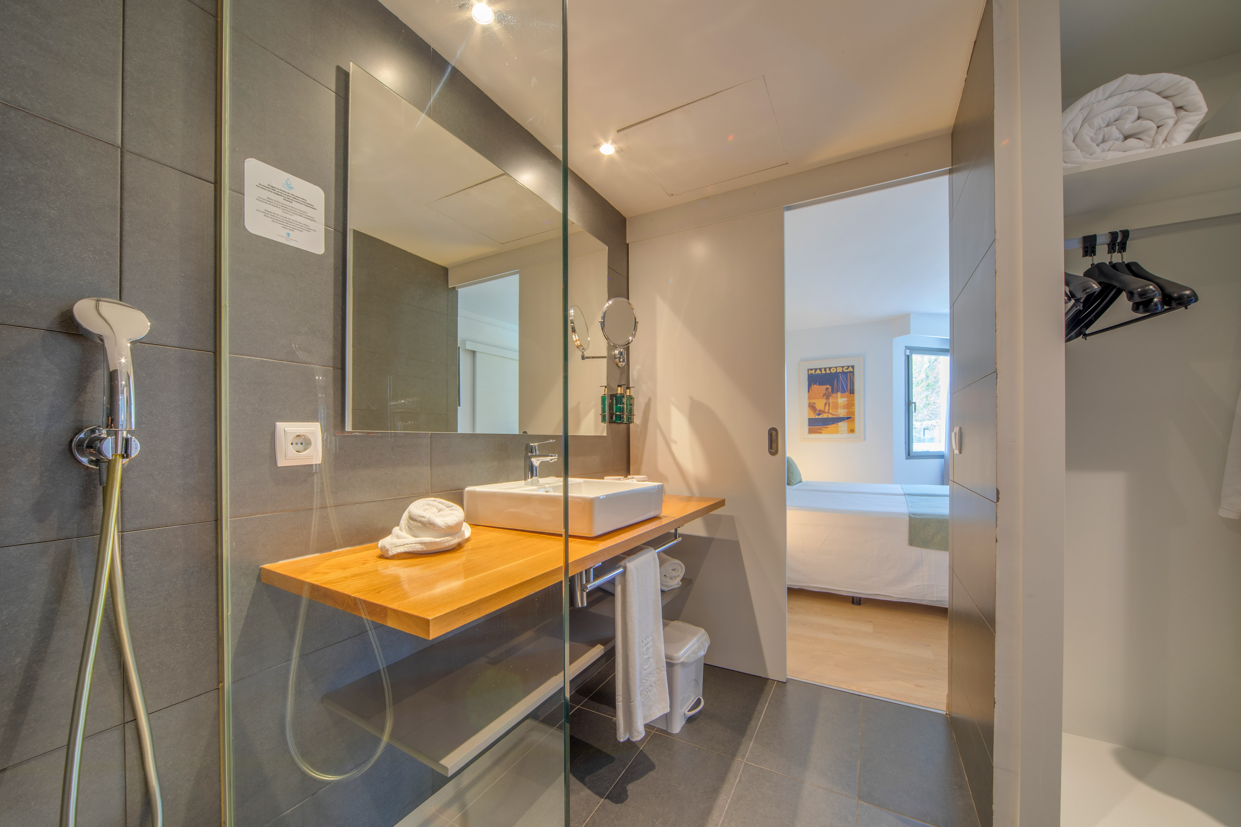a bathroom with a glass shower door