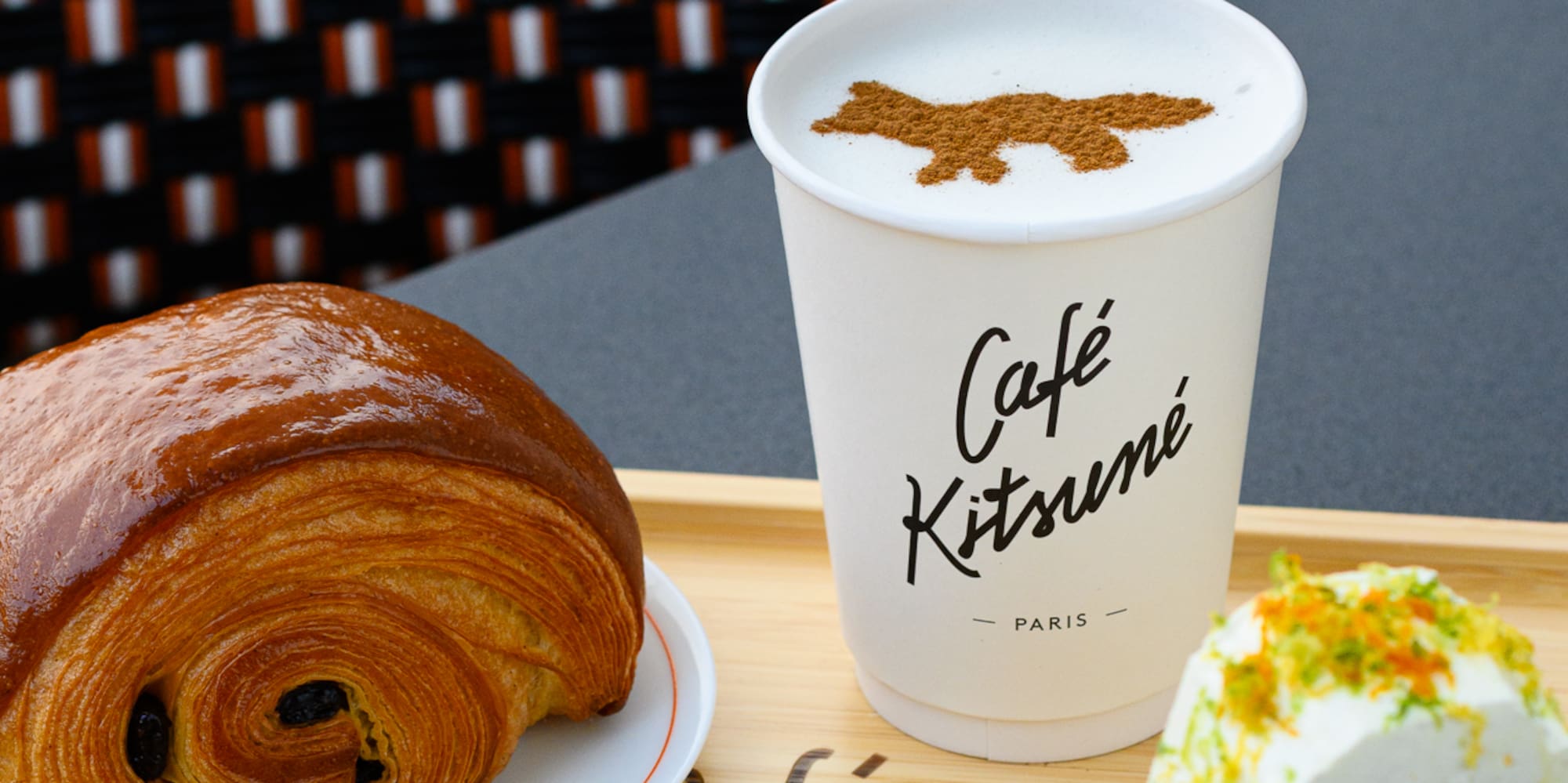 a tray of pastries and a cup of coffee