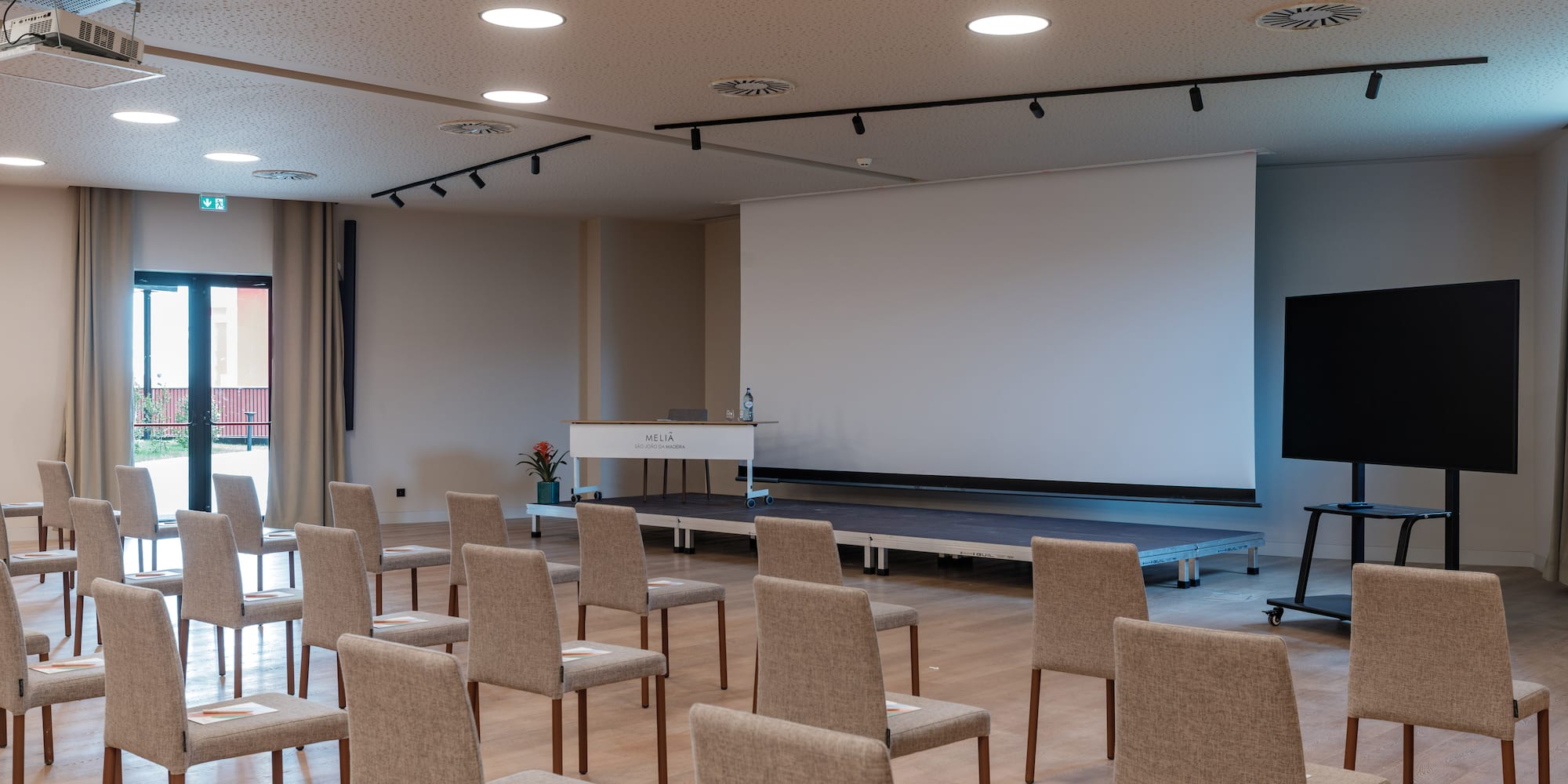 a room with chairs and a stage