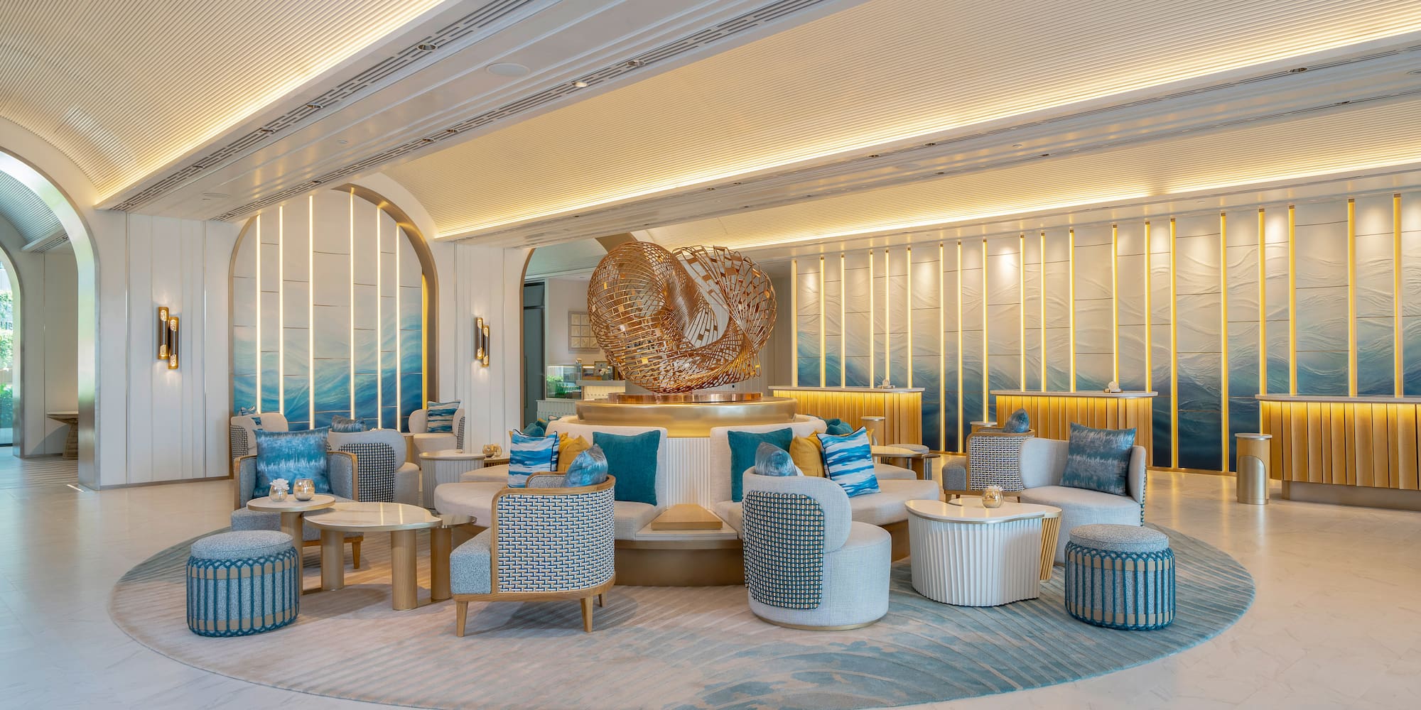 a room with a large round table and chairs