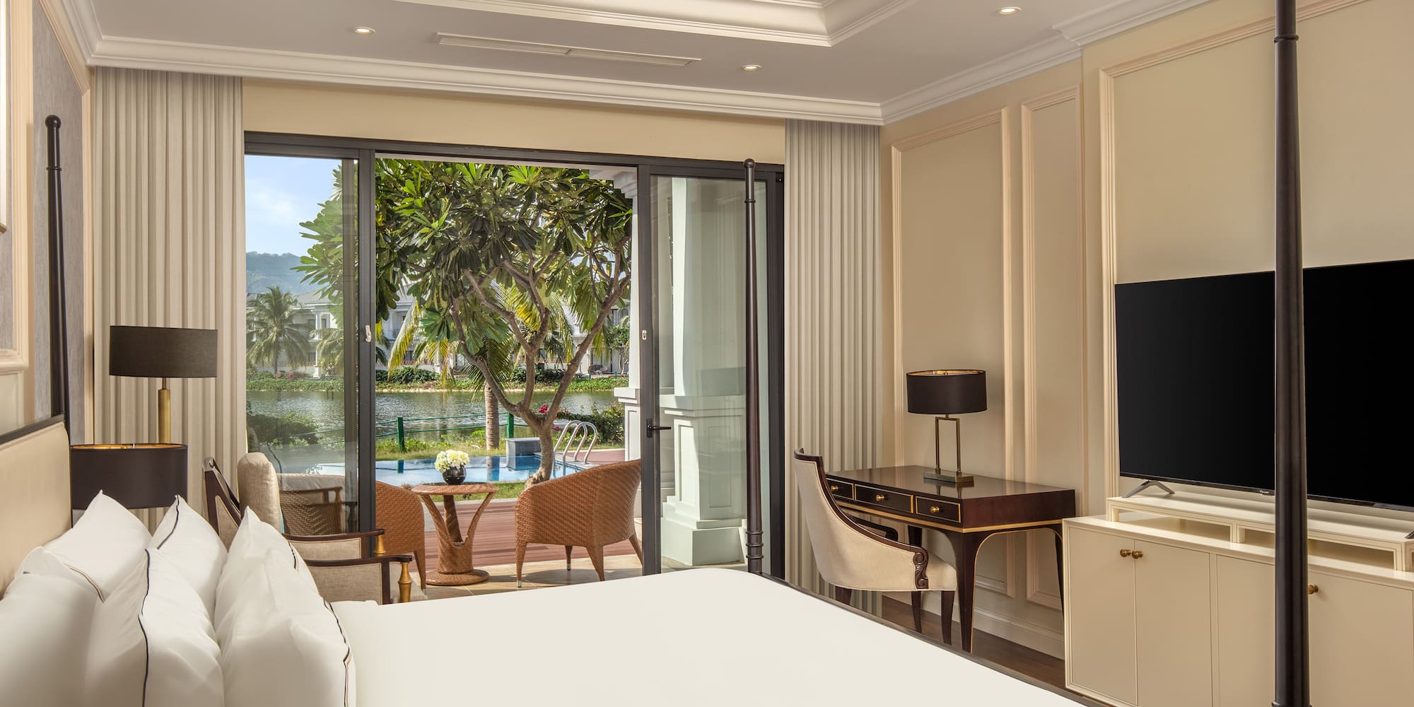 a room with a bed and a television