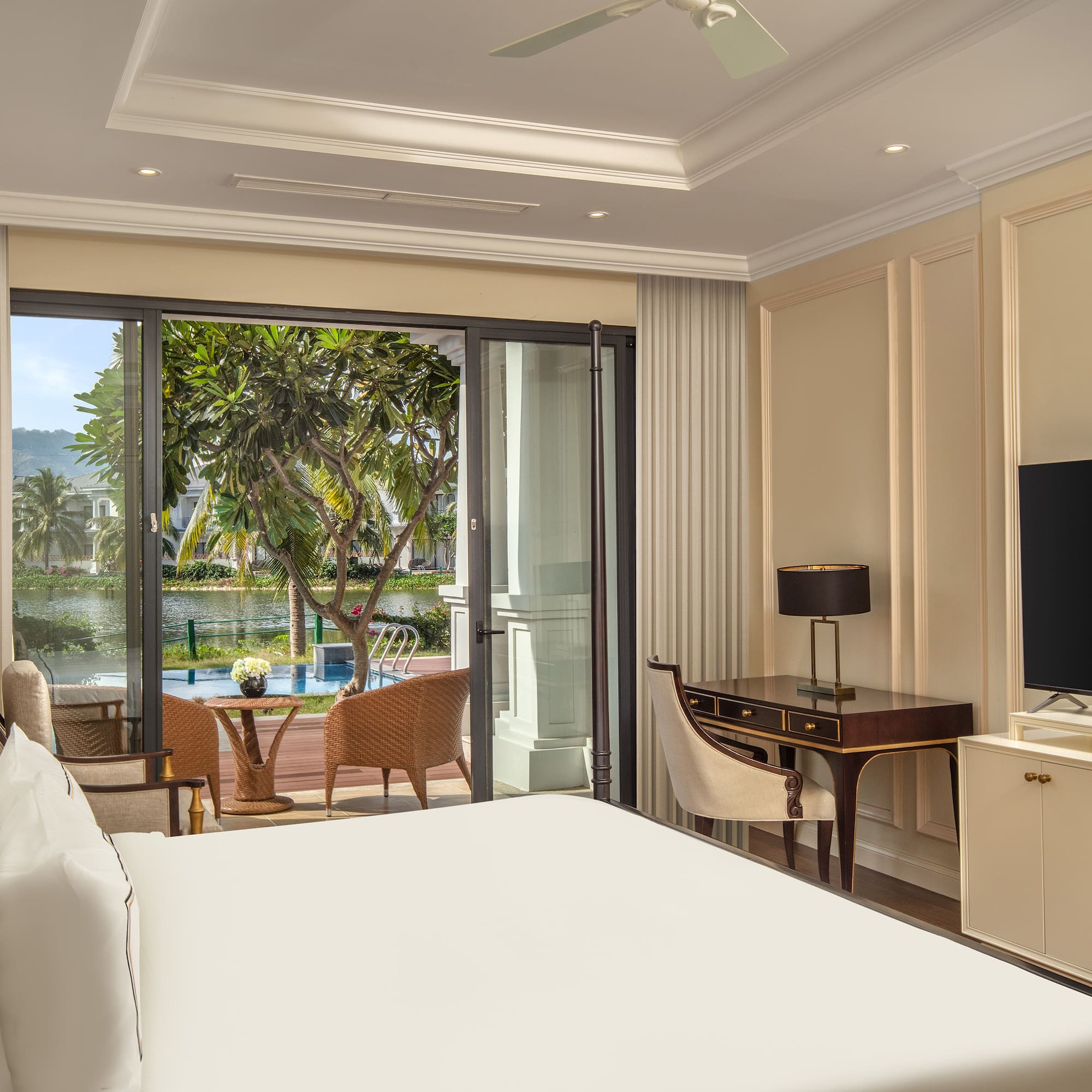 a room with a bed and a television