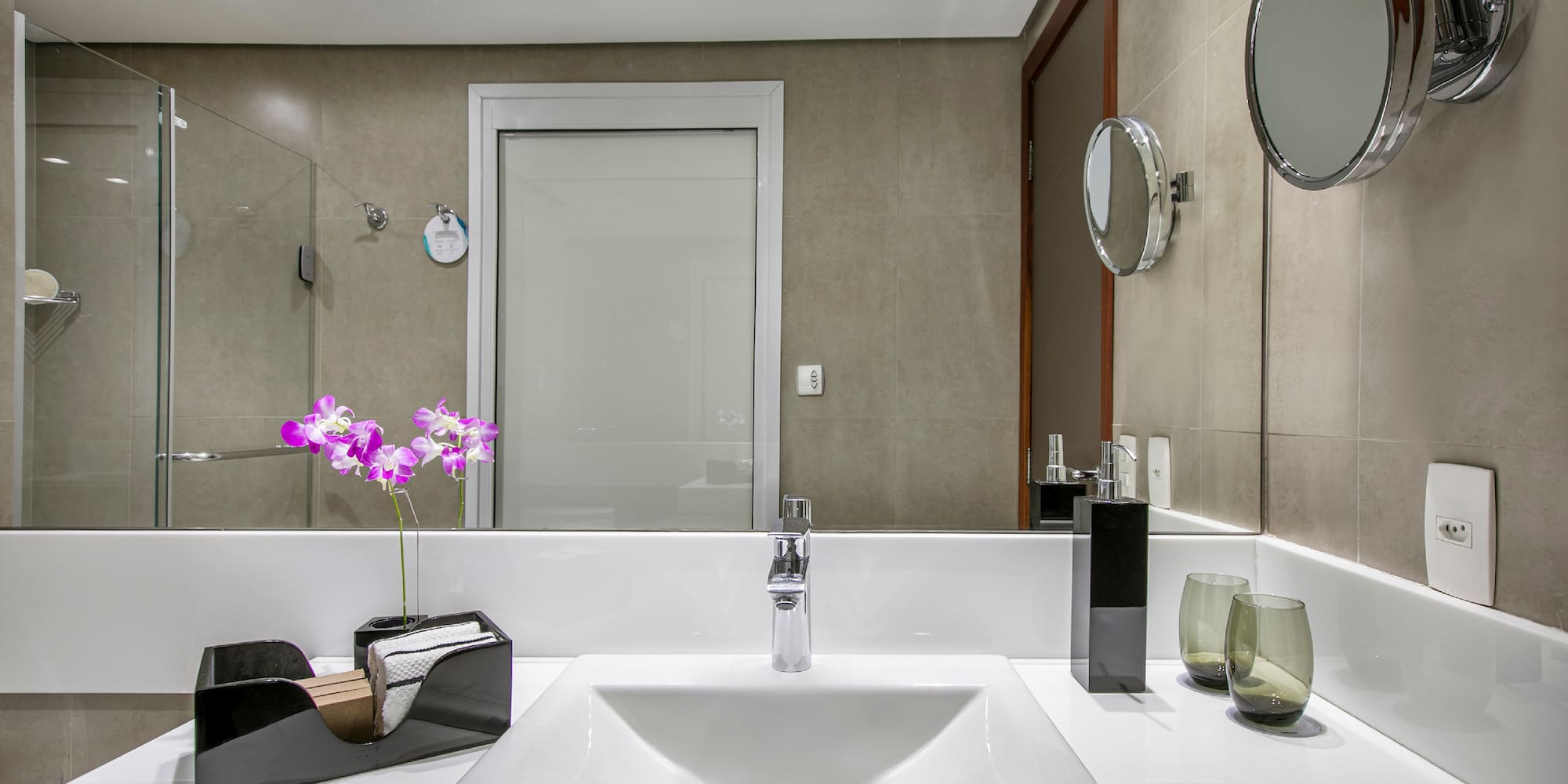 a bathroom with a mirror and sink