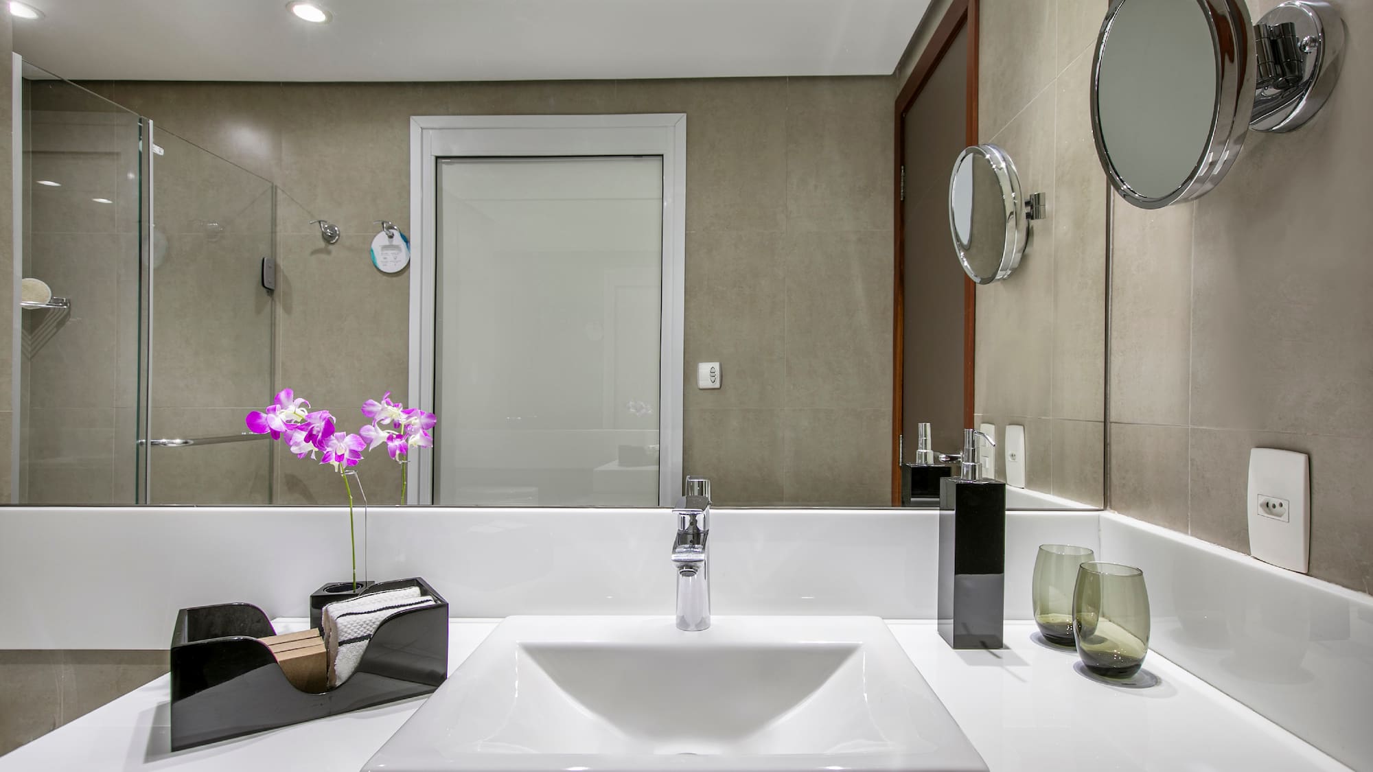 a bathroom with a mirror and sink