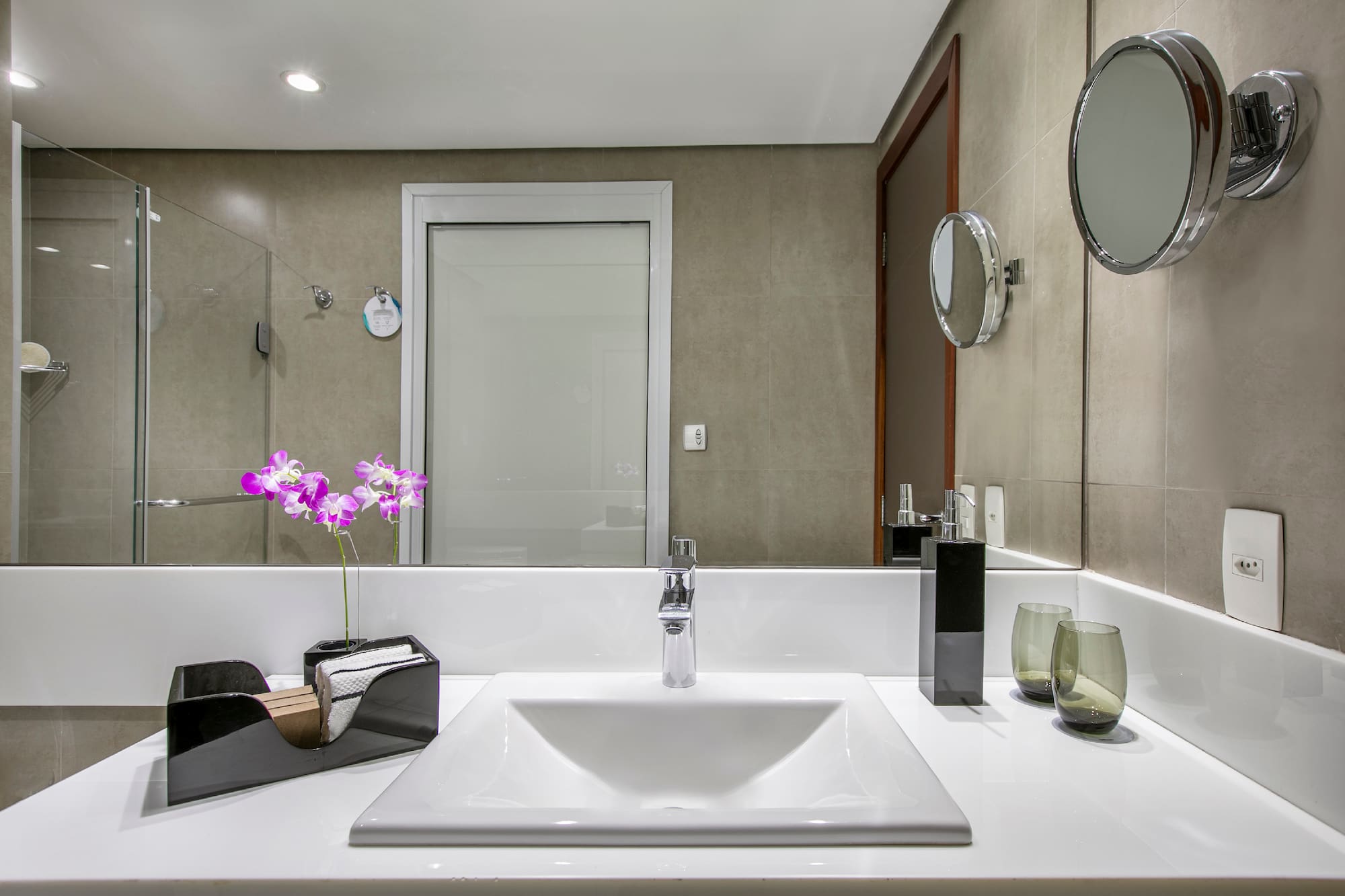 a bathroom with a mirror and sink