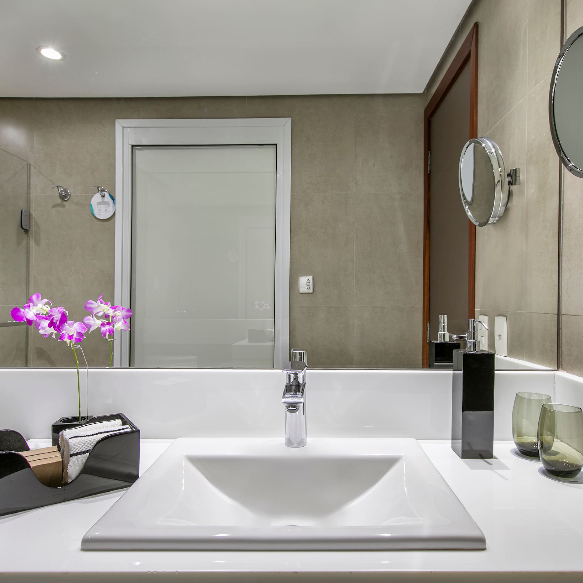 a bathroom with a mirror and sink