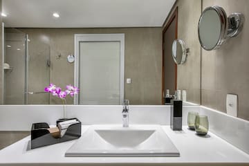 a bathroom with a mirror and sink