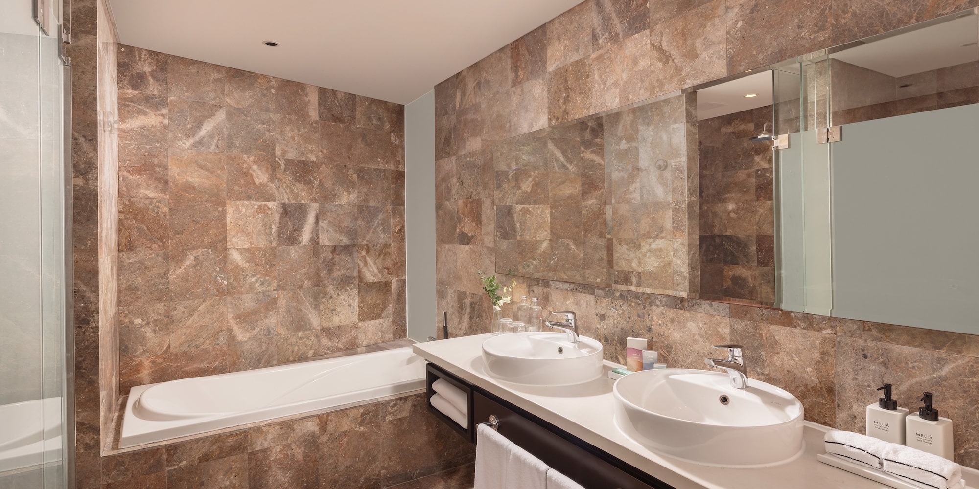 a bathroom with marble tiles