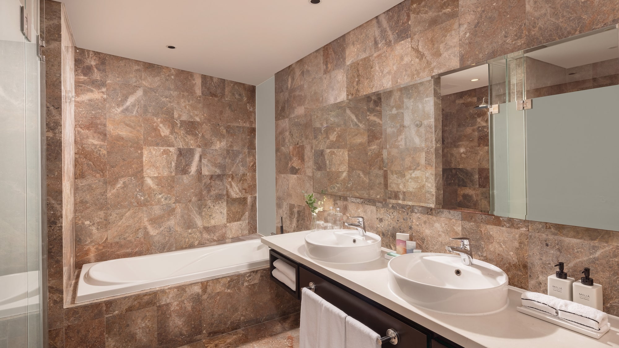 a bathroom with marble tiles