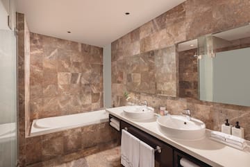 a bathroom with marble tiles