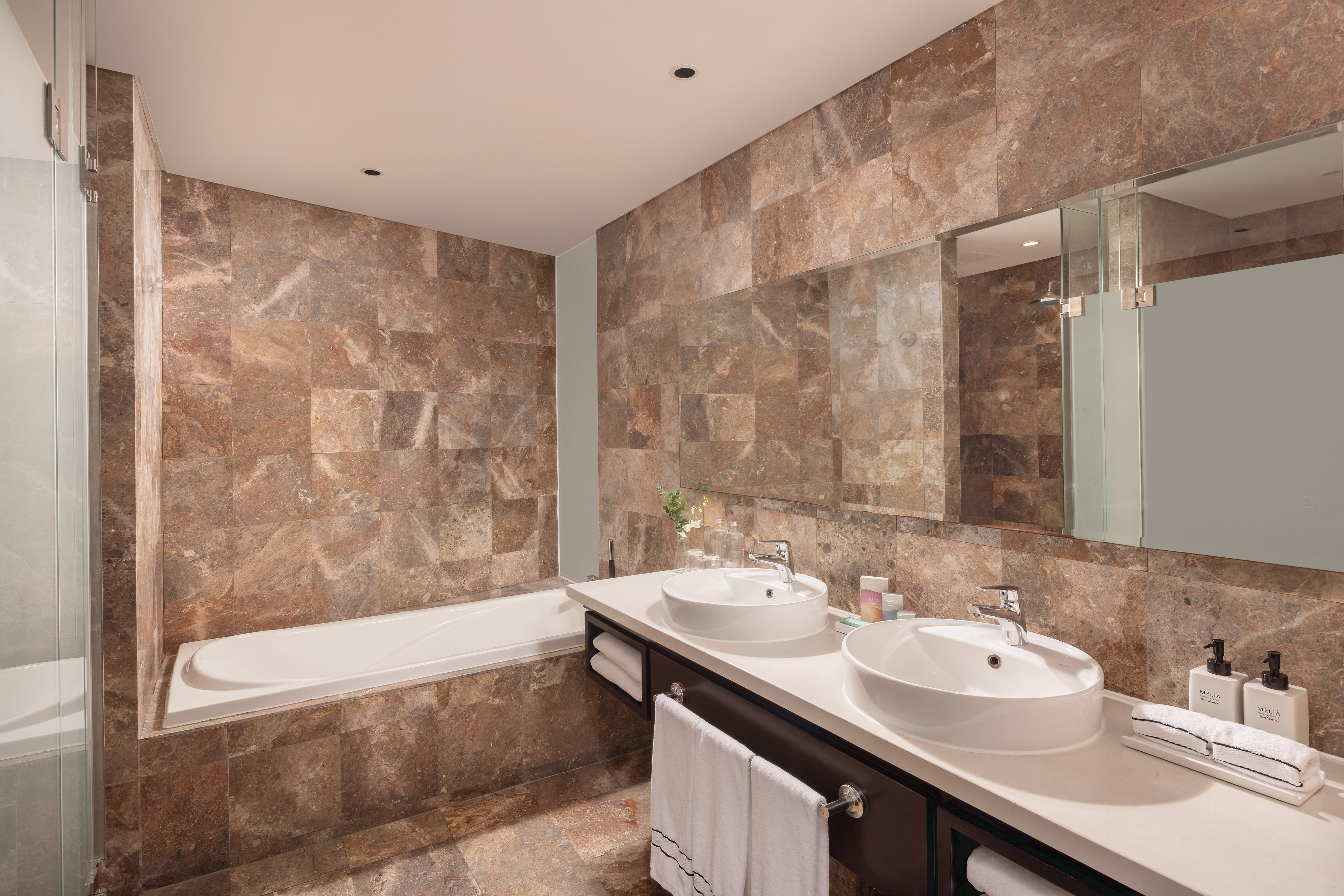 a bathroom with marble tiles