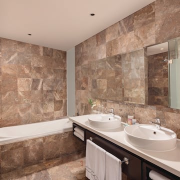 a bathroom with marble tiles