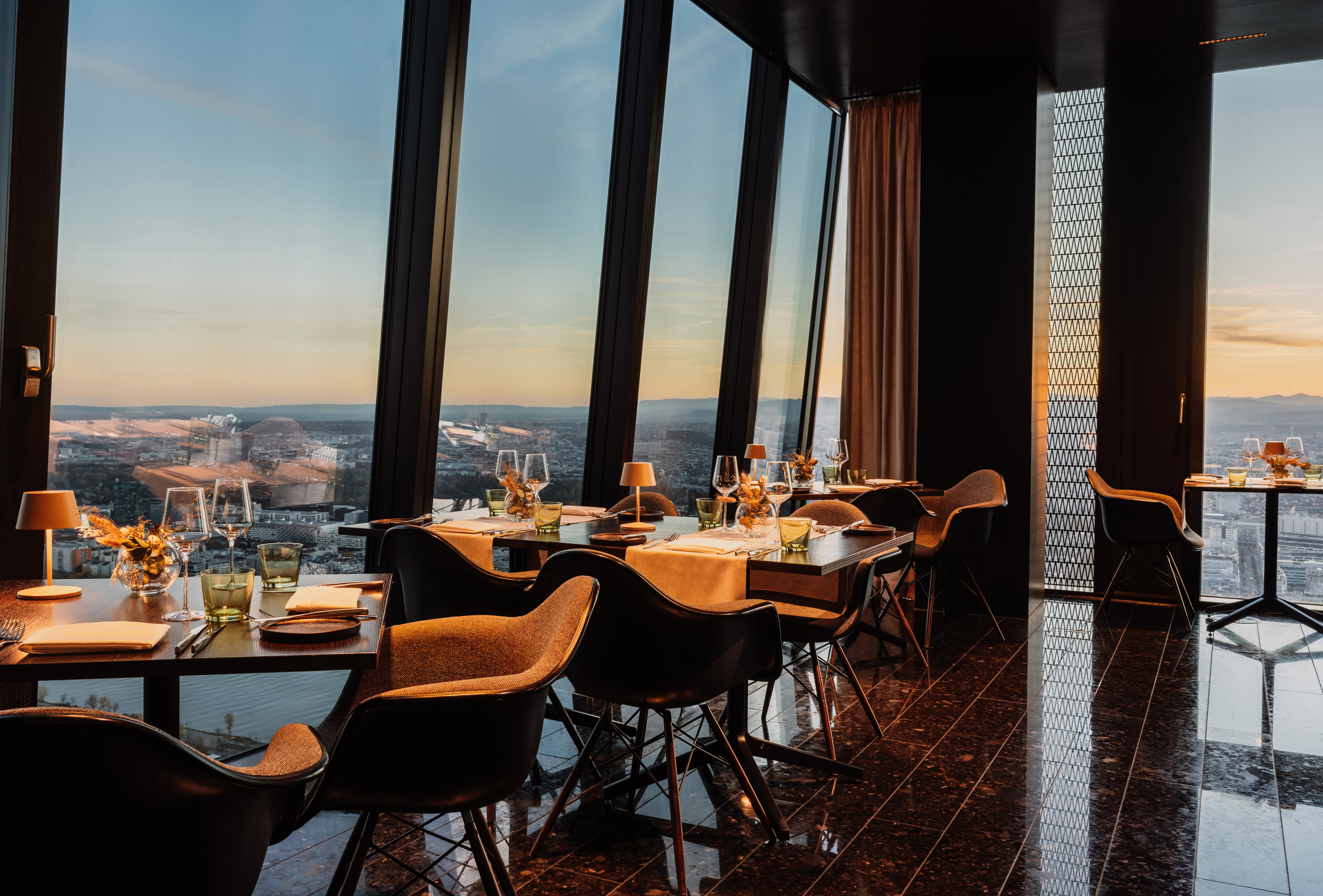 a restaurant with a view of the city