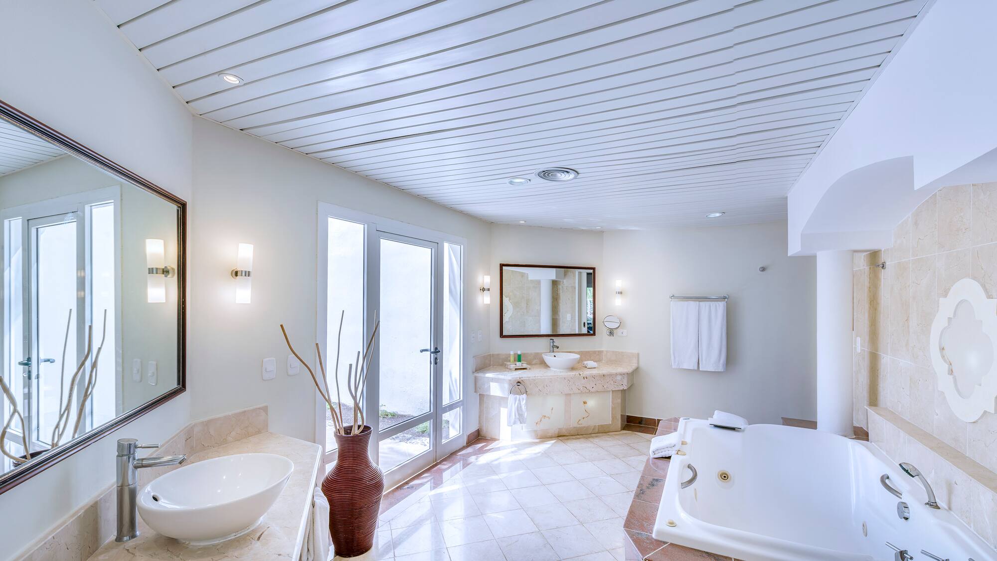 a bathroom with a tub and sink