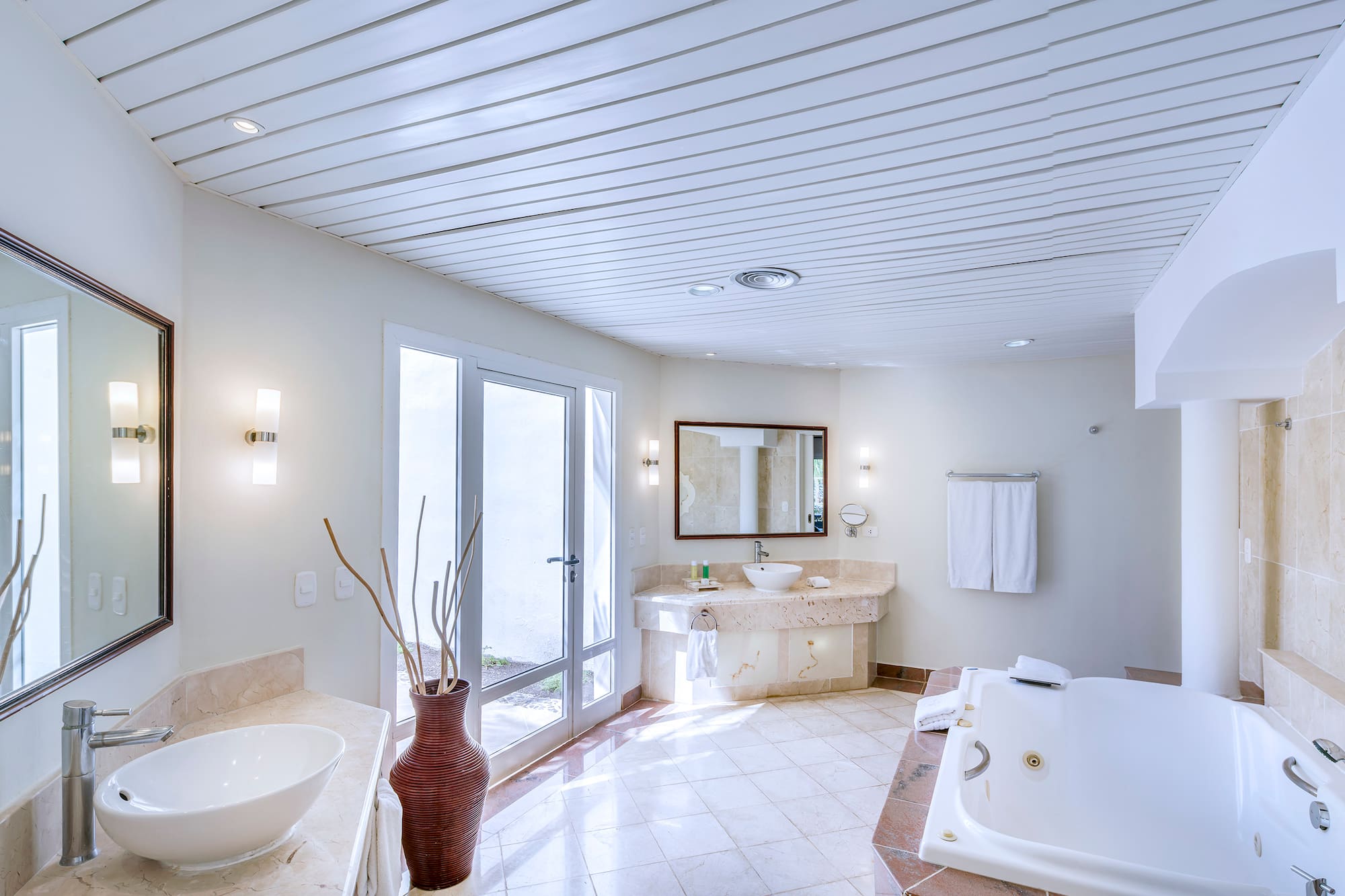 a bathroom with a tub and sink
