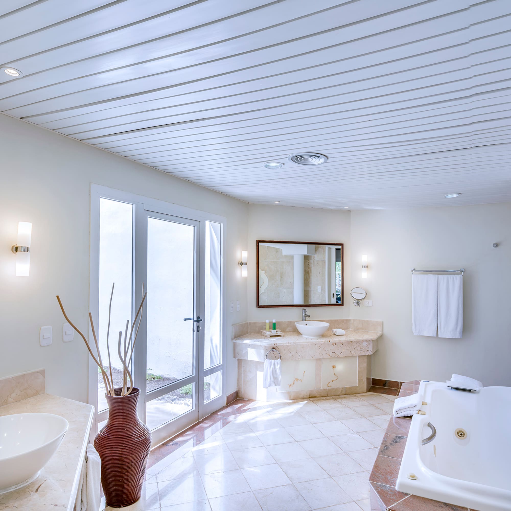 a bathroom with a tub and sink