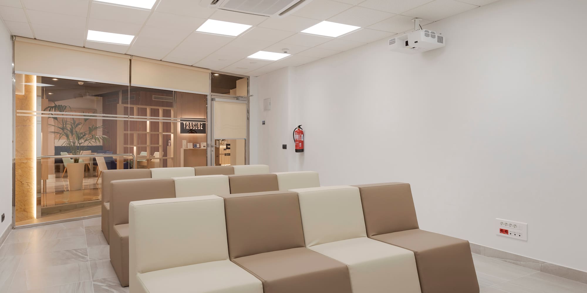 a room with white and brown chairs