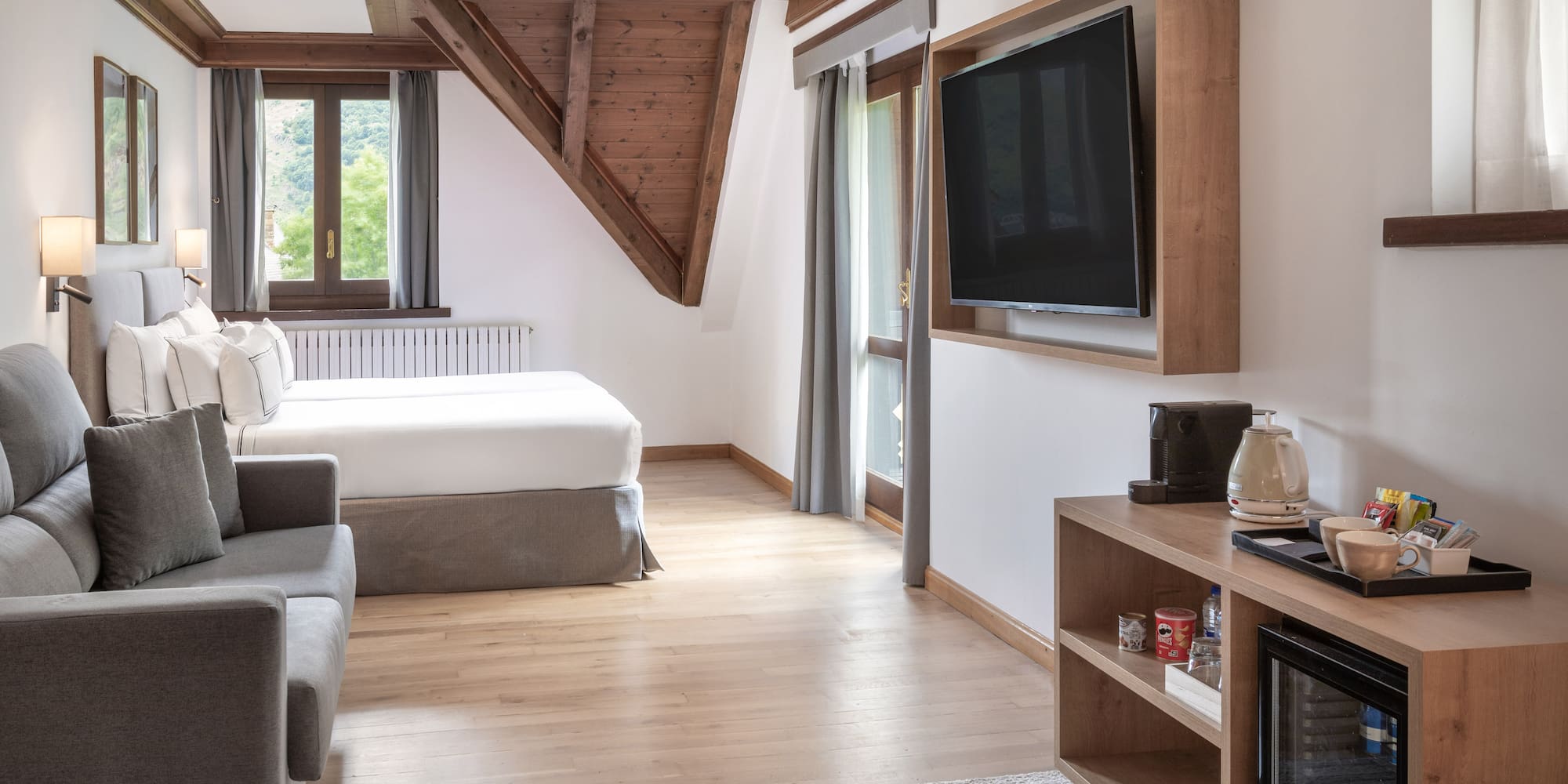 a room with a tv and a bed