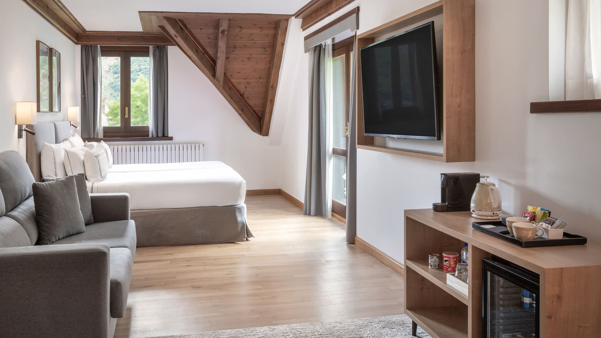 a room with a tv and a bed