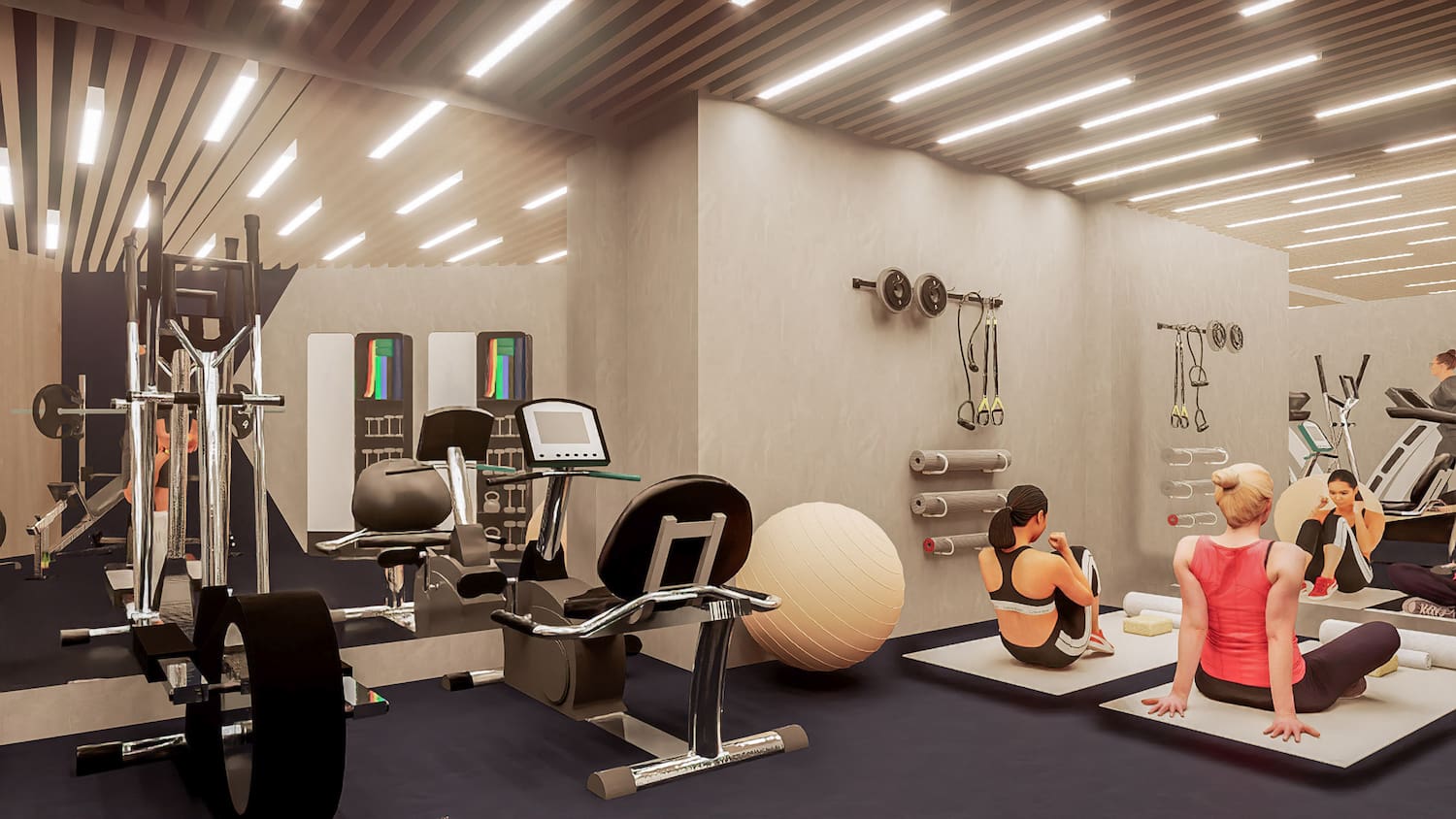 a woman sitting on the floor in a gym