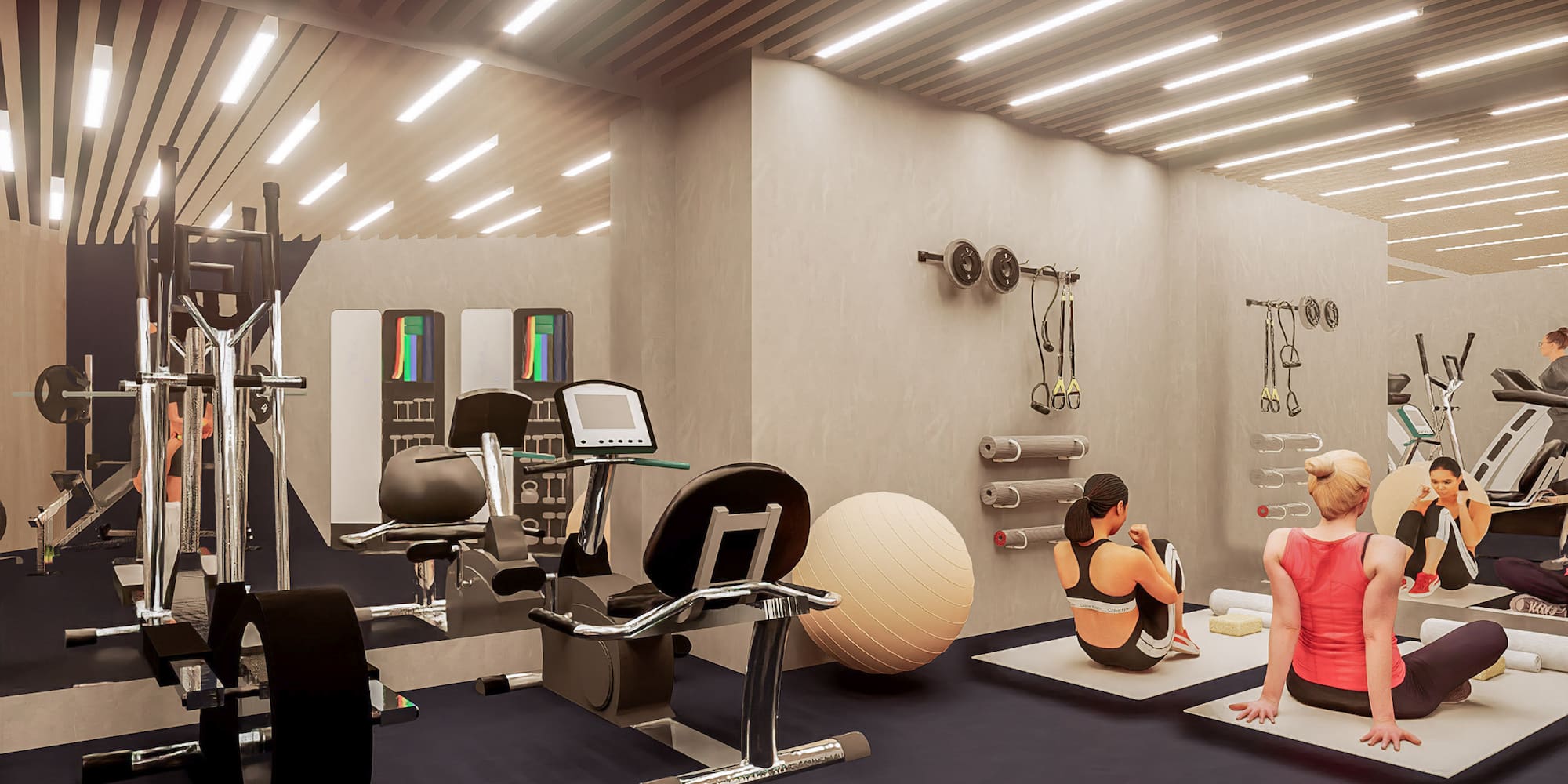 a woman sitting on the floor in a gym