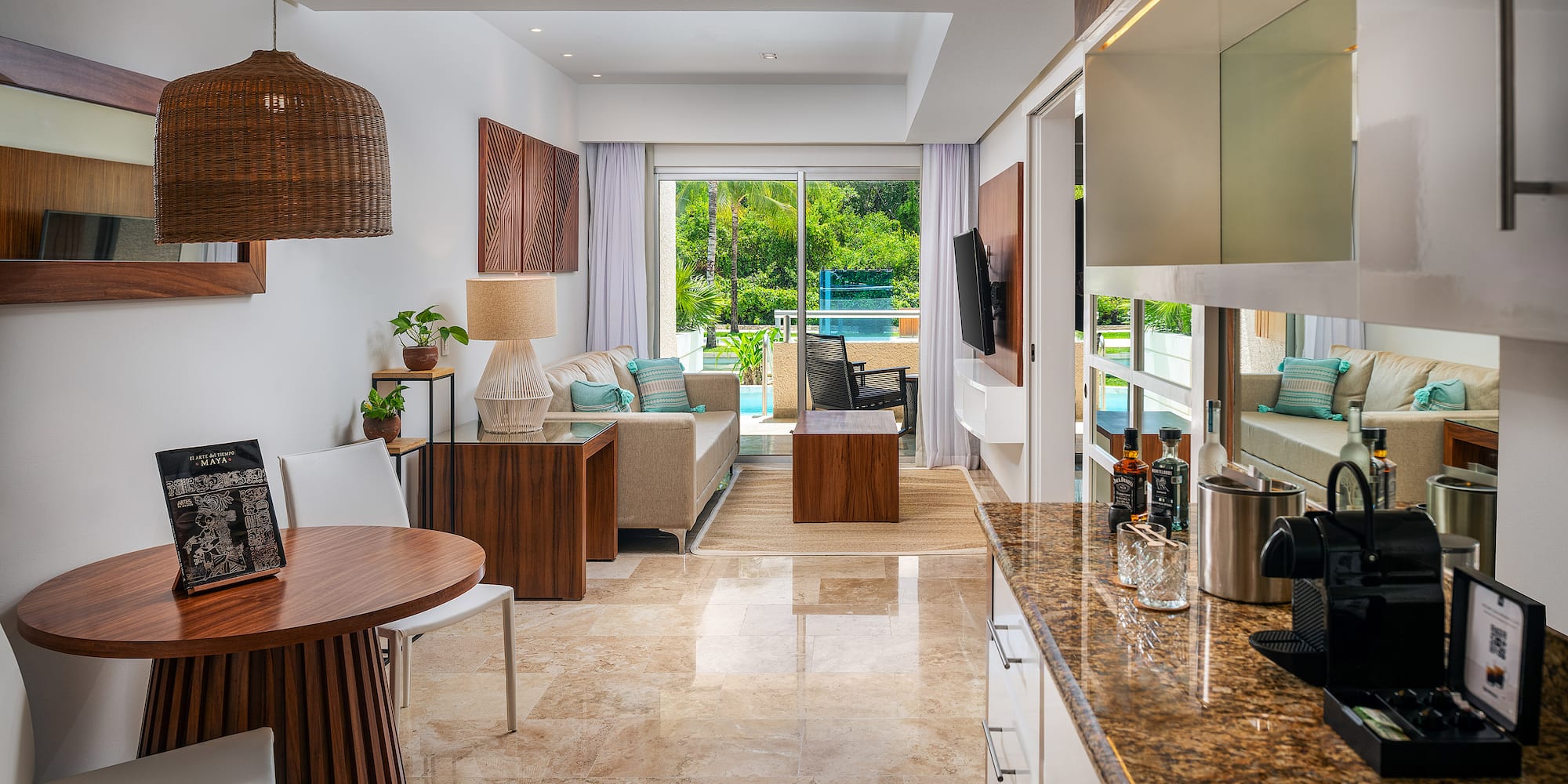 a room with a table and chairs and a television