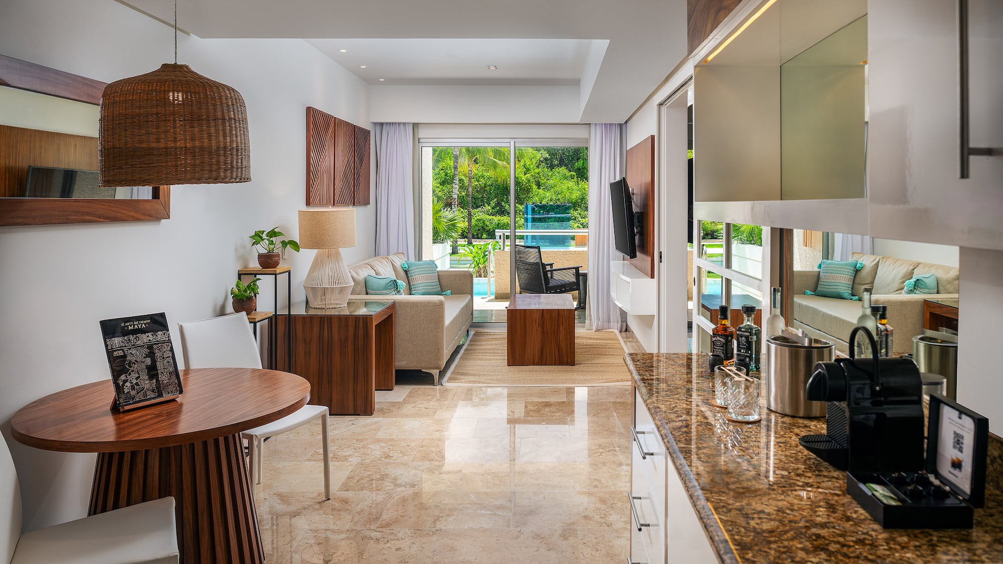 a room with a table and chairs and a television