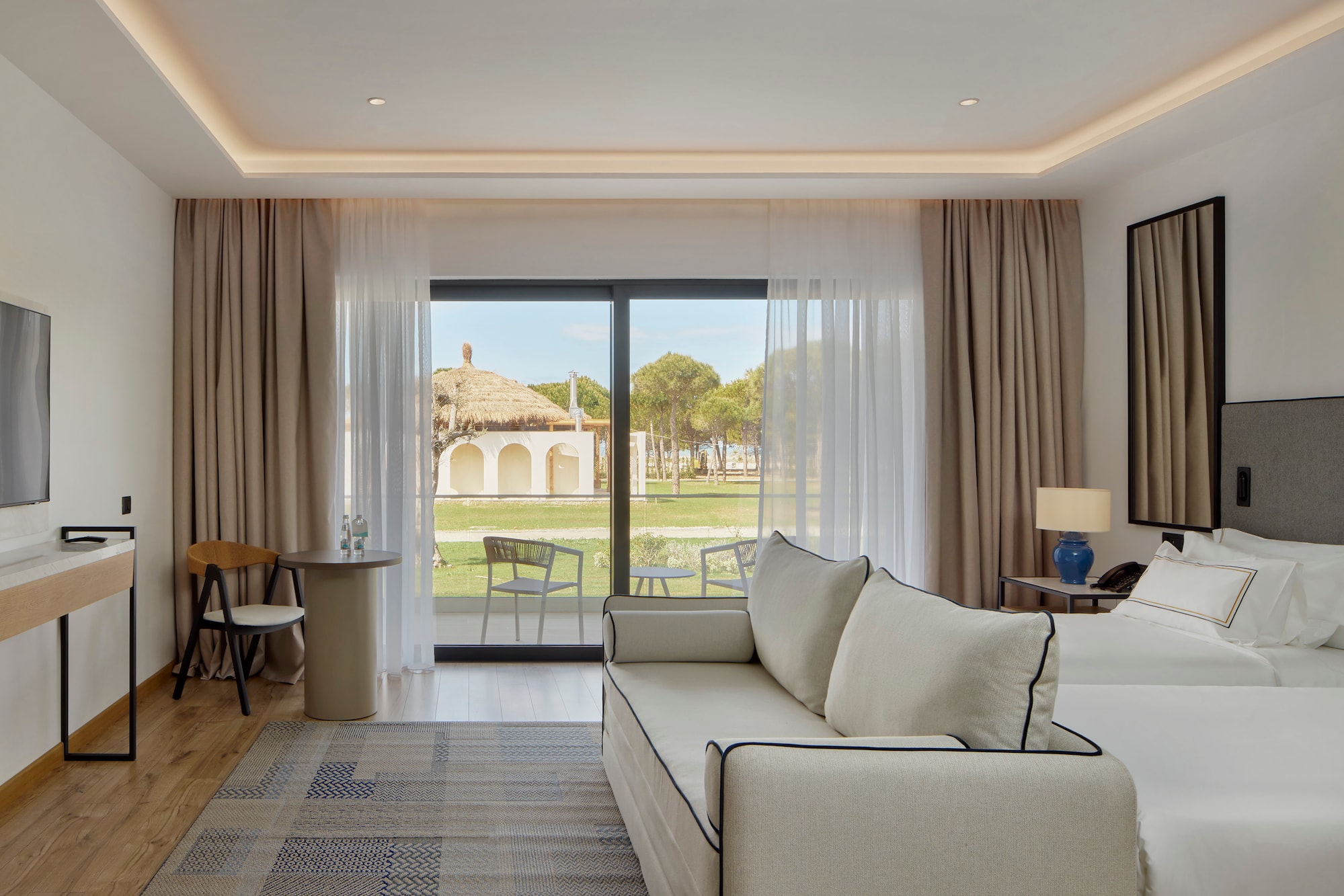 a living room with a couch and a table and chairs