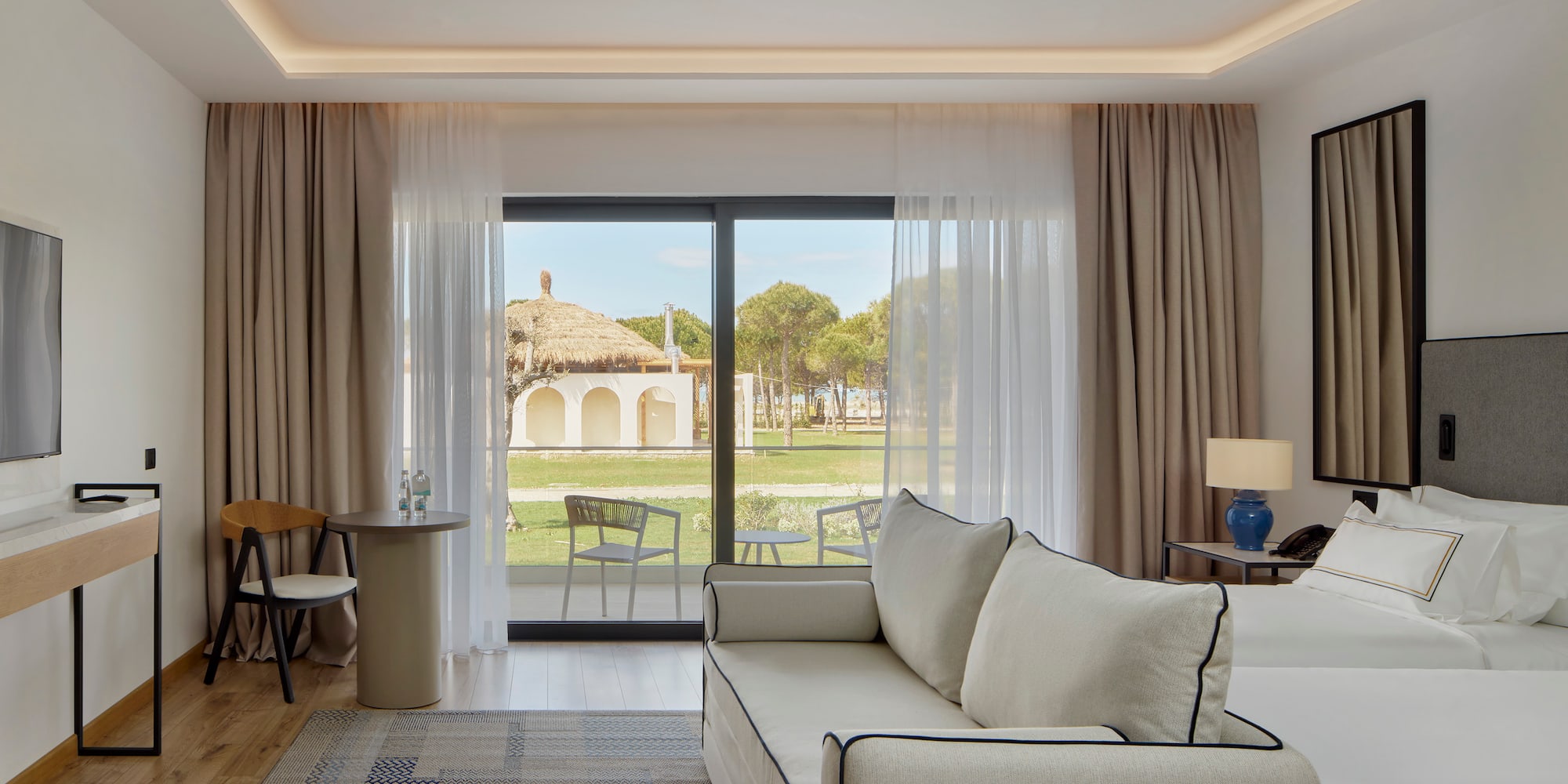 a living room with a couch and a table and chairs